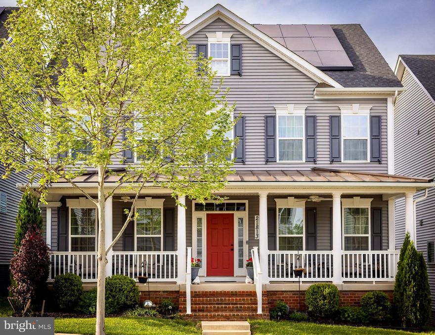 Truly better than new, this stunning contemporary Clarksburg home, built in 2020, is loaded with thoughtful upgrades, designer finishes, and exceptional indoor-outdoor living. With over 5,276 finished square feet, this rare model features a walkout basement leading to a private backyard retreat that feels like your own luxury resort. Relax to the soothing sound of the koi pond waterfall, entertain under the covered patio dining area, or enjoy the expansive upper deck with stairs connecting both outdoor spaces seamlessly. Owned solar panels help keep electric bills incredibly low, and the attached two-car garage includes an electric vehicle charger. The welcoming covered front porch adds classic charm and everyday comfort.

Inside, the dramatic hardwood waterfall staircase with wrought iron balusters makes an unforgettable first impression. Rich hardwood flooring flows throughout the main level, where the formal living and dining rooms elegantly frame the foyer. A private main-level office with glass French doors provides the perfect work-from-home setup. Rarely found, this home offers two primary en-suites, including a desirable main-level primary suite and an additional luxurious upper-level primary suite.

Designed for both everyday living and entertaining, the centerpiece of the home is the expansive open-concept gourmet kitchen, family room, and stunning dining area. 

The kitchen is beautifully appointed with granite countertops, tiled backsplash, a massive center island with breakfast bar seating, double wall ovens, a newer refrigerator, walk-in pantry, and an impressive bank of buffet and glass-front display cabinetry. A convenient butler’s beverage bar adds both style and functionality.

Upstairs, the elegant primary ensuite features two walk-in closets, double vanities, a soaking tub, and a tiled shower. An ensuite secondary bedroom, plus two additional generously sized bedrooms connected by a hall bath, complete the upper level.

The bright walkout lower level offers exceptional flexible living space, including a spacious rec room, gym area, guest or game room with doors, and a full bath. Step directly outside to the fully fenced backyard oasis where the tranquil waterfall and koi pond create a peaceful setting guaranteed to melt away stress.

Additional highlights include dual-zone HVAC, contemporary finishes throughout, upgraded lighting, and an ideal location just minutes to I-270, Black Hill Regional Park, shopping, and the community pool. Beautifully maintained and thoughtfully upgraded throughout, this elegant home offers the rare opportunity to simply move in, relax, and enjoy every detail already completed for you.
