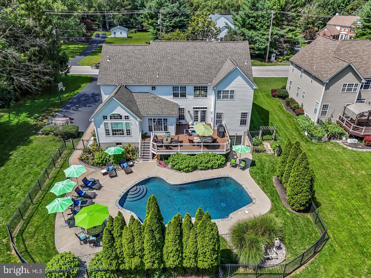 Welcome to 882 Shavertown Road! This incredible house hasn't been available in almost 20 years and it is worth the wait. Abundant curb appeal lures you into the driveway and the hardscape walkway starts your journey into a truly remarkable home. Gleaming hardwood floors guide you through this pristine center hall colonial. The cozy living room is a perfect getaway after a long day. The decor in the powder room will wow your guests, and for those hard working days from home, enjoy the spacious office with abundant light and view of the backyard. The dining room is ready for holiday gatherings! The heart of the home, the kitchen, is a perfect space, the large island, new backsplash , newer appliances, open flow to the breakfast room and great room, make this is an entertainer's and chef's dream. Whether you use the main or rear staircase, the second level does not disappoint. The primary suite offers a plethora of space with large sitting area, two walk in closets and generously sized primary bath with duel vanities and large tub. 4 additional bedrooms are serviced by two Jack and Jill bathrooms. The laundry room and "office nook" complete this level. Now to the basement which is nothing short of a showstopper. No matter what you are looking for, this has it all. The thought that went in to this design is second to none. The "movie theater" is great for game-day or movie night. Make your way to the custom fireplace to warm up with a drink and a game of chess. The massive bar, with two beverage fridges, plenty of cabinet space, and sink are ready for the biggest of parties. Test your skills with a game of pool or throw the top on and maybe try your hand at ping pong. After all the fun, you probably need a little workout! Hit the gym, for a light run or throw some weights around, and not to worry, you can shower in the beautiful modern bathroom just steps away. Additional storage and utility room completes the lower walkout level. As all this wasn't enough, make your way onto the massive new trex deck overlooking your personal Oasis. This flat level yard is highlighted by the low maintenance saltwater pool with new coping, new tile and new cover. The large fenced in pool area has mature landscaping and access to that incredible basement! A newer roof, newer HVAC systems, new hot water heater, award winning schools, easy access to major roadways, this home checks all the boxes! Come get a first look at the open house August 21, 5;00-7:00PM! Showings begin at open house Thursday.