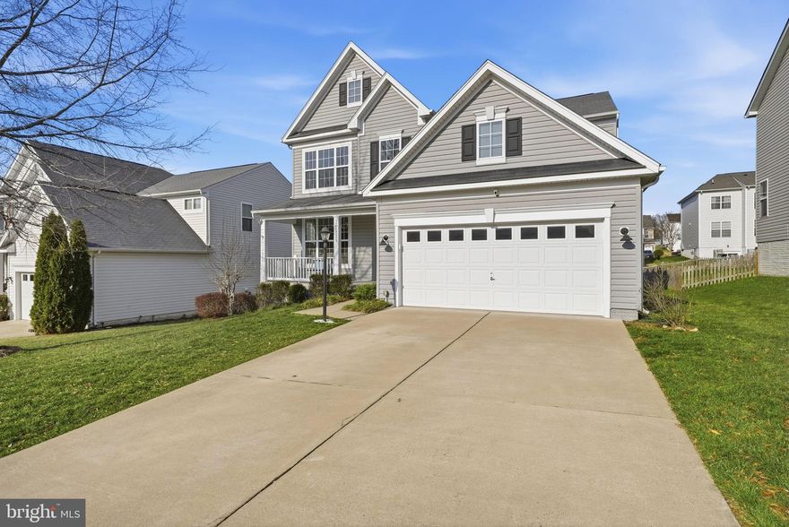 Welcome to 15005 Spriggs Valley Court, a spacious and versatile residence offering over 4,400 finished square feet across three thoughtfully designed levels in one of Woodbridge’s established communities. With six bedrooms and five full bathrooms plus a half bath, the home provides the space, flexibility, and functionality buyers are looking for today.

Inside, the layout feels both welcoming and practical, with living spaces designed to flow naturally from one area to the next. A combination living and dining area creates flexibility for gatherings, celebrations, or everyday living. Just beyond, the family room off the kitchen serves as a central gathering space, anchored by a fireplace that adds warmth and comfort throughout the seasons.

A main-level bedroom adds valuable versatility and can easily serve as a guest suite, private office, fitness room, or flexible living space—an increasingly desirable feature for modern lifestyles.

Upstairs, generously sized bedrooms provide privacy and comfort while maintaining a cohesive layout designed for everyday convenience. The abundance of bedrooms and bathrooms helps streamline busy mornings while allowing space for both shared living and personal retreats.

The finished lower level expands the home’s functionality even further. This level includes a large bedroom that offers privacy and separation—ideal for guests or extended living arrangements. The basement also features a kitchenette-style setup with a sink, wine refrigerator, and cabinetry, creating a convenient space for entertaining, movie nights, or hosting visitors. The large refrigerator currently in the basement will be removed. An unfinished section of the basement provides additional storage space, helping keep the home organized and uncluttered.

Throughout the home, the layout prioritizes flexibility, allowing living areas to adapt easily to changing needs—whether creating work-from-home space, hosting gatherings, or simply enjoying the comfort of additional room.

The home is currently being fully painted and updated with brand-new carpeting, offering a refreshed, move-in-ready presentation for its next owners.

One of the home’s most special features can be enjoyed right from the front porch, where sunset views stretch across the pond and treetops, creating a peaceful setting to start the day with coffee or unwind in the evening.

Located within the Meadows at Hope Hill Crossing community, the neighborhood offers a welcoming environment while benefiting from HOA services that help maintain the area’s appeal.

The location also provides excellent commuter convenience with easy access to Prince William Parkway, Route 234, and Interstate 95, connecting residents to Quantico, Fort Belvoir, Alexandria, Arlington, and Washington, D.C.

Shopping, dining, and entertainment are just minutes away at Stonebridge at Potomac Town Center and Potomac Mills, offering a wide variety of restaurants, retail options, and everyday conveniences.

With its generous square footage, flexible layout, scenic views, and fresh updates, 15005 Spriggs Valley Court offers a rare combination of space, comfort, and adaptability—designed for both everyday living and memorable gatherings.