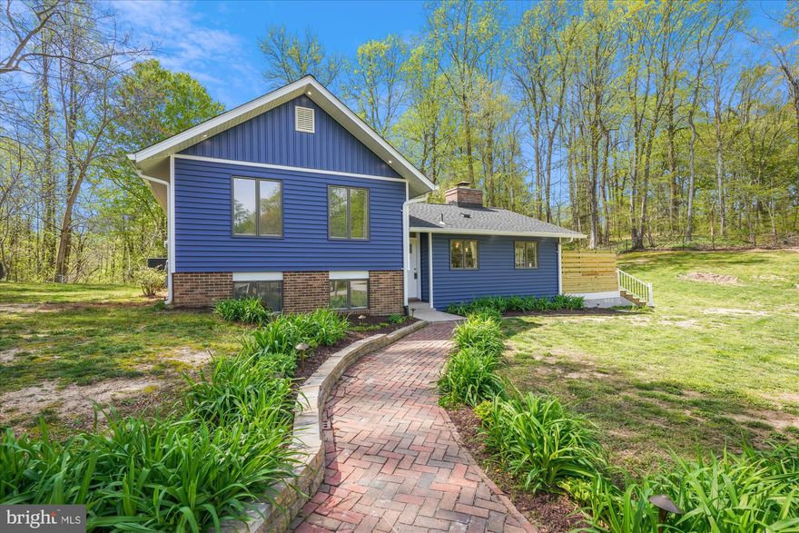 Come check this home out for yourself.. This home has a new roof that was installed in 2023, new HVAC, open floor plan with an updated kitchen with stainless steel appliances, tile and hardwood floors, granite countertops and a large eat around breakfast bar. The sliding doors in the kitchen and dining room, leads to the outside decks overlooking the beautiful landscape of the yard with your very own pool. The amazing large bonus room located off the living room has extra-large windows around as well as it's own split unit. 
 Enjoy the outside views of nature.  This house now has 5 bedrooms.  3 are located on the same level with it's own primary suite and an additional bathroom to share with the other two rooms.   There are an 2 bedrooms and 1 full baths and a laundry room on the lower level. This home sits on 1 acre of land surrounded by trees. This house also comes with a basketball court (where the trampoline is located now), above ground pool and plenty of nature. Schedule a showing today.