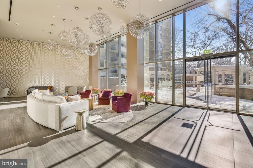 Great opportunity to own this gorgeous, tastefully-decorated/fully-furnished condo in a luxury building in Friendship Heights/Chevy Chase neighborhood. The Condo building is located approximately 3 blocks north of the DC border and is easily walkable to the Friendship Heights Metro Station and Bus Station. The unit is offered fully furnished and furniture can convey if wanted. It includes a dedicated underground parking space which is just a few steps away from the elevator that whisks you (and your groceries) up to your floor. Your new home will offer convenient urban living that is sure to impress your guests! This bright, sophisticated, spacious home features a renovated white kitchen with blue accent cabinets, new appliances, white & subtle-gray quartz countertops with plenty of storage space, and soft-close drawers. The kitchen sports a huge/deep/wide food-preparation surface, sure to delight the gourmet cook inside of you. Fantastic living room and dining area features an enormous wall of floor-to-ceiling glass windows and sliding glass door leading to a lovely balcony offering a majestic view of the Friendship Heights neighborhood and Page Park. The master bedroom has a walk-in closet and another enormous floor-to-ceiling window with a fantastic/romantic view of the area. Nicely updated bathroom with new faucets, toilet, shower system and plumbing, and a very nice vanity. Large linen closet and coat closet are in the foyer and hallway. New light-colored upgraded carpets have been installed in January 2022.  Stunning furniture conveys and includes one flat-screen Samsung Smart TV in the master bedroom and one curved-screen Samsung Smart TV with Bose speaker in the living room. Most decorating accessories are also included. Washer and dryer are located inside the unit. Condo fee includes all utilities. One garage space (G1-55) and one storage space (G1/E1/B03) convey. This is a fantastic location, just a few minutes’ walk to Metro, Capital Crescent Trail, Wholefoods, Amazon Fresh, and dozens of fine shops and restaurants in and around the wonderful Friendship Heights neighborhood. Although everything is a short walk, you can also use the free Friendship Heights Shuttlebus/Circulator to ride to the Metro Station, Bus Station, and local grocery stores.  Don’t miss this wonderful opportunity to live in a beautifully renovated building with a gorgeous new grand lobby, hallways, magnificent entrance, and impressive driveway to hail your ride. Smoke-free building with fabulous amenities such as secure package handling, 24-hour front desk with attendant, management on site, library, fitness center, sauna, party room, and a fabulous and fun sparkling heated outdoor swimming pool.