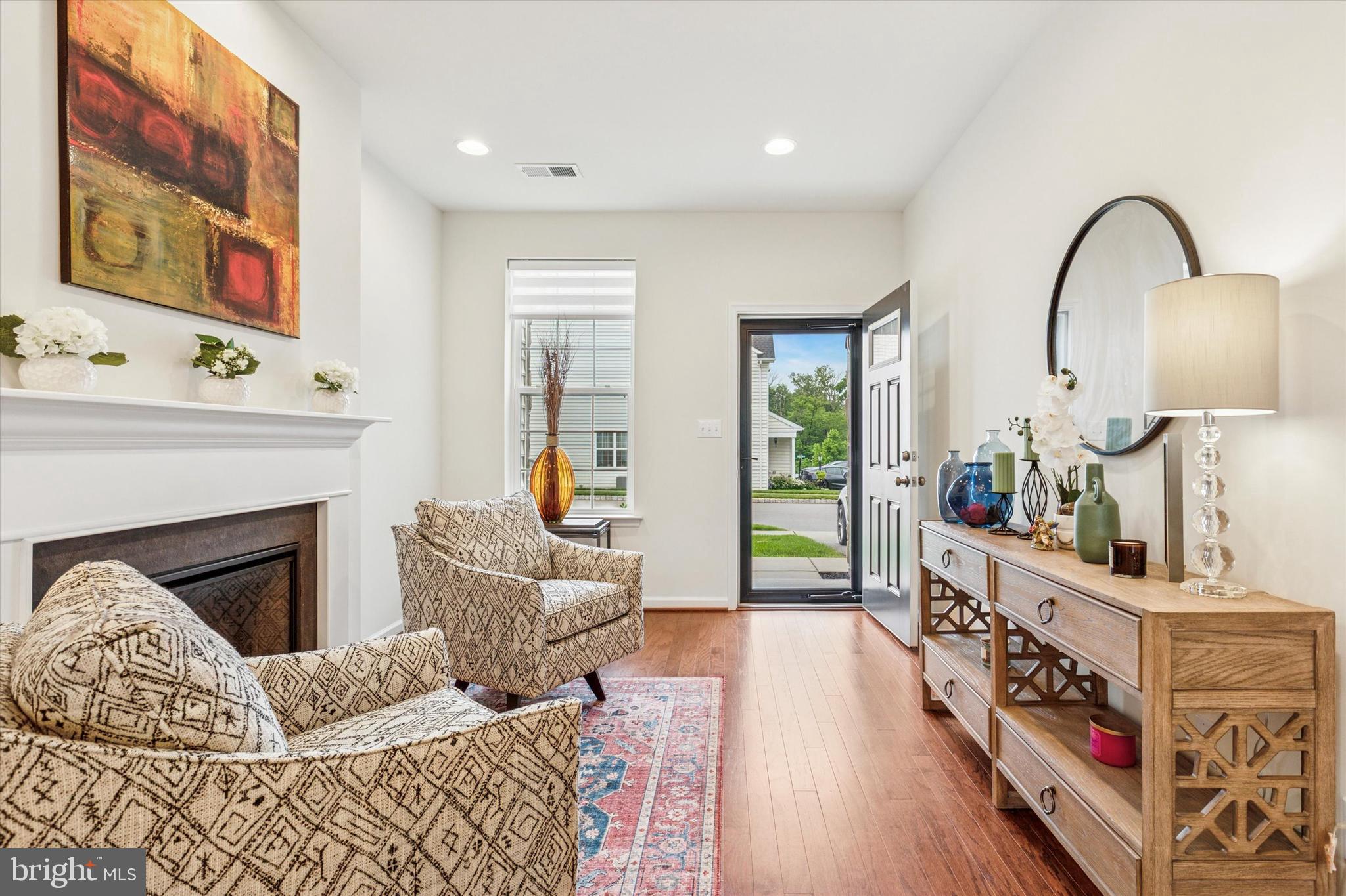 Welcome to 425 Cherry Blossom Lane in the heart of West Norriton’s desirable Reserve at Stoney Creek community. Built in December 2021, this modern townhouse offers a blend of luxury and functionality. With 1,854 square feet of living space, this home features 3 spacious bedrooms and 2.5 baths.
The open-concept living area on the first floor boasts 9-foot ceilings, an electric fireplace, and remote-operated custom linen blinds, as well as hardwood floors. The gourmet kitchen is equipped with a gas stove, granite countertops, a wine rack, and a large 7ft center island—perfect for entertaining. It seamlessly opens to a deck, ideal for outdoor dining and enjoying the fresh air. The primary bedroom is a retreat, complete with a custom walk-in closet and an en suite bathroom including a marble-topped double vanity. Enjoy the spacious upper level laundry room with a sink and the comfort of a Lennox high-efficiency HVAC system and central air conditioning.
Additional highlights include a driveway and attached garage for convenient parking and storage. The grounds include ample guest parking spots for visitors. Located directly across from Norristown Farm Park, enjoy access to 8 miles of walking and biking trails, picnic areas, recreational fishing, with a soon-to-open dog park. Plus, the home is within walking distance to Whitehall Elementary School and Norristown Area High School. Experience comfort and convenience in a vibrant community setting. Come and see this beautiful home today!