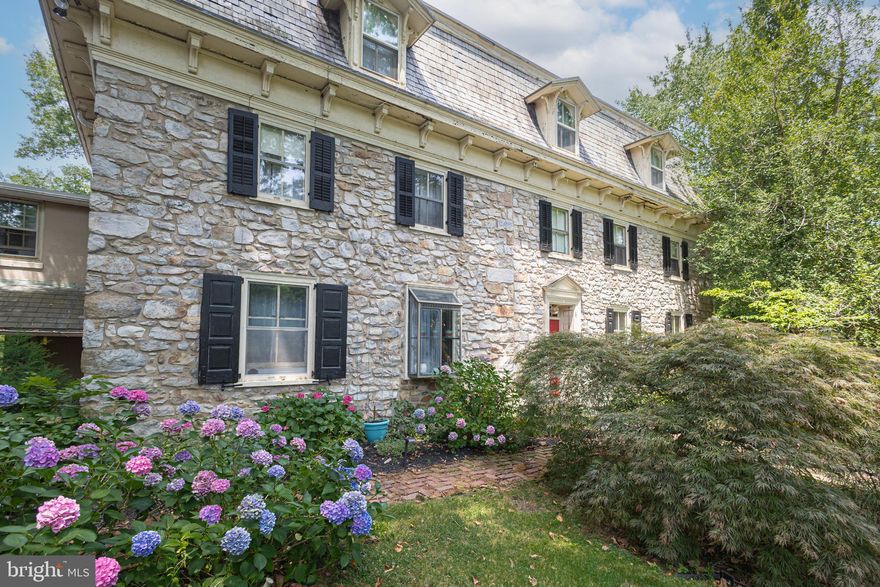 If you want to immerse yourself in Bucks County life surrounded by fresh air, countryside fields and farmland, Mill Creek Farm, a wonderful farmstead has what you are looking for and more! Nicely nestled on 14+ scenic acres, this circa 1730s historic property, once a quaint B&B, offers endless amenities beginning with an original stone manor, 13-stable horse barn, summer kitchen, corn crib, tennis court, pool with hot tub and a pond. Over the years the barn has been converted and renovated into 5 income producing apartments yet still keeping the horse stables intact along with two birthing areas that were used to breed thoroughbreds, making it very much a working farm in its day. The main house includes 5 bedrooms, 5 full baths and a convenient half bath. The rooms are comfortable with period dated hardware, deep windowsills, exposed ceiling beams and exposed stone walls. A favorite space in the manor is the enclosed porch adorn with bar and several sitting areas overlooking the Lahaska Creek flowing through the back of the property where you can rest in front of the stone fireplace and enjoy the picturesque views. At night you can step outside for backyard fireside chats by the creek and see a full sky of stars while listening to the sounds of nature or relax in the other delightful outdoor living areas such as the cozy spot by the summer kitchen known as The Crape Myrtle Pub with bar offering indoor and outdoor seating.  A bonus find on the third floor are the rare high ceilings and two private bedrooms with bonus storage. Perfect for a family compound and/or equestrian enthusiast this farm is situated about a mile away from town; along a quiet country road - Quarry Road, named after a quarry that used to exist a long time back at the end of the road which supplied the stone that gives the distinctive style to the buildings in the area. Overlooking green pastures, apple orchards, a pond and acres of serene gardens yet convenient to many Bucks County attractions and close to Doylestown, Lahaska’s Peddlers Village, and New Hope with its assortment of eateries and shops. Experience the peaceful grounds of this horse farm where William Penn held the farm’s first deed and immerse yourself in the country scenery and you’re sure to fall in love with this unique property!