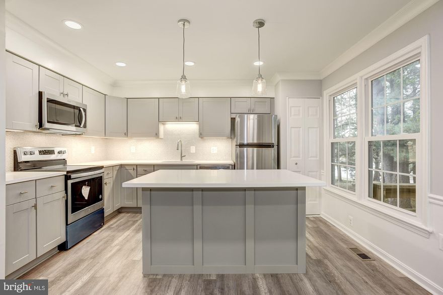 Offers reviewed Monday 10/21 at 7PM. Gorgeous farmhouse-inspired design in this fully renovated townhome. * A stunning blend of modern and rustic. * Quality craftsmanship. * Keen attention to detail. * New expanded kitchen with shaker-style cabinets. * Big center island for extra counter space, storage and seating. * Low-maintenance, solid quartz countertops. * Stainless Steel appliances. * Designer tile backsplash. * Recessed lighting. * Under cabinet lighting. * Twin pendant lights. * Deep single-bowl sink. * Pull-out goose neck kitchen faucet. * This is your dream kitchen. *Open to dining area and access to alfresco dining and grilling at an outdoor deck. * Modern wood style flooring on main level. * Craftsman crown molding and chair rails on the main level. * Stunning powder room with Spanish tiles, wall mount vanity, marbled quartz top, designer mirror and legacy lighting. * New carpets on upper and lower levels. * New LED light fixtures in bedrooms. * Renovated bathrooms oozing with old world charm. * Master shower with custom frameless glass door and rain head shower. * Hall bath with soaking tub and 7-inch tub spout. * Moen faucets and marbled solid quartz tops. * Kohler toilets. * Fully finished walk-out basement with fireplace and half-bath. * New windows. * Fresh paint throughout with designer colors. * New fence. * New patio. * Great community of townhomes in an excellent location. * One assigned parking with plentiful guest parking available. * Walk to Target. * Walk to the VRE Station for an easy commute to DC, Pentagon and Amazon HQ2. * Within short driving distance to George Mason University, Wegmans, Walmart, Whole Foods and all the shopping and dining establishments in Burke Centre. * Easy access to the Fairfax County Parkway and all the trails and parks available close by. * Close to major employment hubs. * Convenient yet bucolic. A perfect setting. * Agent is Owner.