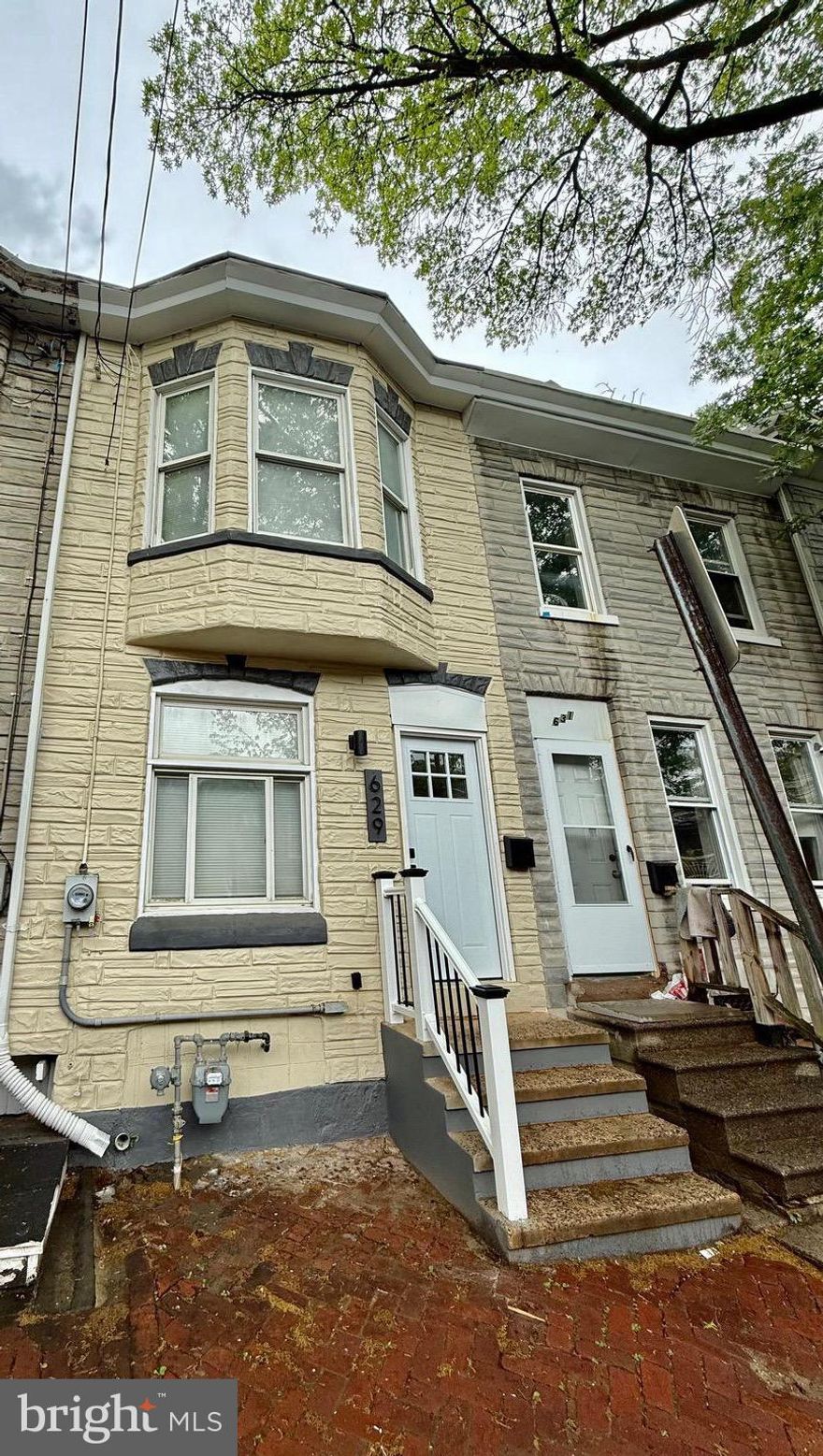 You will fall in  love With  this Gorgeous 3 Story Row Home,  Fully updated from top to bottom. This gorgeous home has a lot to offer, starting with the open concept layout, special touches in wood, the interior paint and new flooring makes the space spectacular.  Then the stunning modern Kitchen with Precious Quartz Countertops, brand new stainless steel appliances, and  Modern white cabinetry  will blow you away. Also on the first floor  you will find a half bath which can be great for guests and a laundry room with the  hook up for washer and dryer. On the second floor There are 4 spacious bedrooms and a  redesigned full  bathroom.Then on the third floor the 4th bedroom with great space and natural light. But wait there is more, the water heater is brand new also The Heat  furnace is brand new and fuel with NATURAL GAS great for energy savings. You need storage this house has a room just for that located at the rear of The house.  And last but not least you will not struggle for parking space, there is parking on the back a gravel driveway.