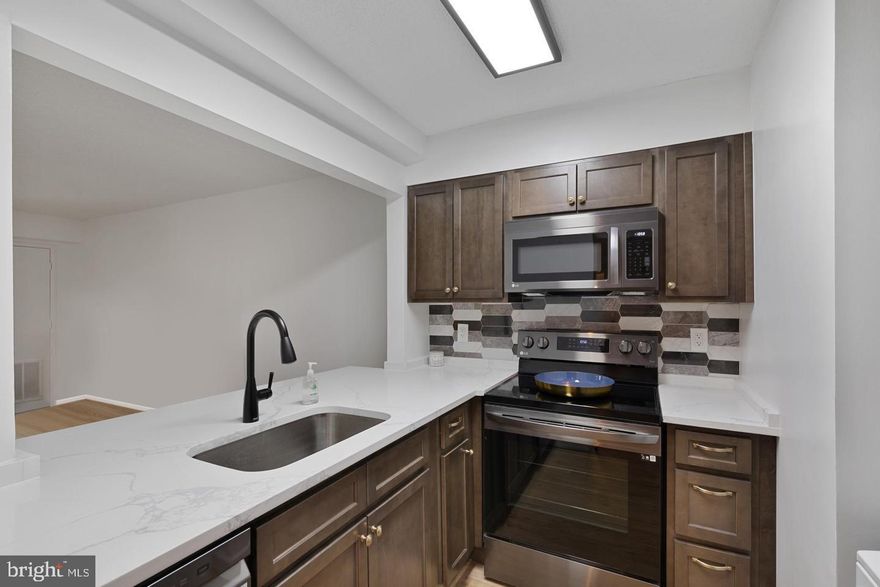 You can't get more convenient than the AltaVista. Located above Ballston Metro with direct access to Ballston Quarter via pedestrian bridge or skywalk.  This renovated 1bed/1bath condo features an open floorplan with durable LVP flooring, The kitchen features beautiful quartz countertops including an over-sized breakfast bar, neutral cabinetry, backsplash, and black stainless steel appliances.  The spacious bedroom has huge closets, fitted with closet organizers and a beautifully updated bathroom.. The solarium has new flooring and a sliding door to separate the unit from the 'outdoor' space. There is a large coat closet by the front door and another large walk-in closet with shelving for storage. If that isn't enough storage, this unit also comes with extra storage space. The condo also comes with one unassigned parking space located in a secured entry underground garage (there is always plenty of space to park). The AltaVista offers 24/7 concierge, fitness center, party room/internet lounge, laundry room and on site management office. On the Mezzanine level you can find Starbucks and an enclosed walkway to Ballston Metro which also connects to the National Science Foundation, Kettler Capital Ice Complex and the Ballston Mall. Pets are considered on case-by-case basis.