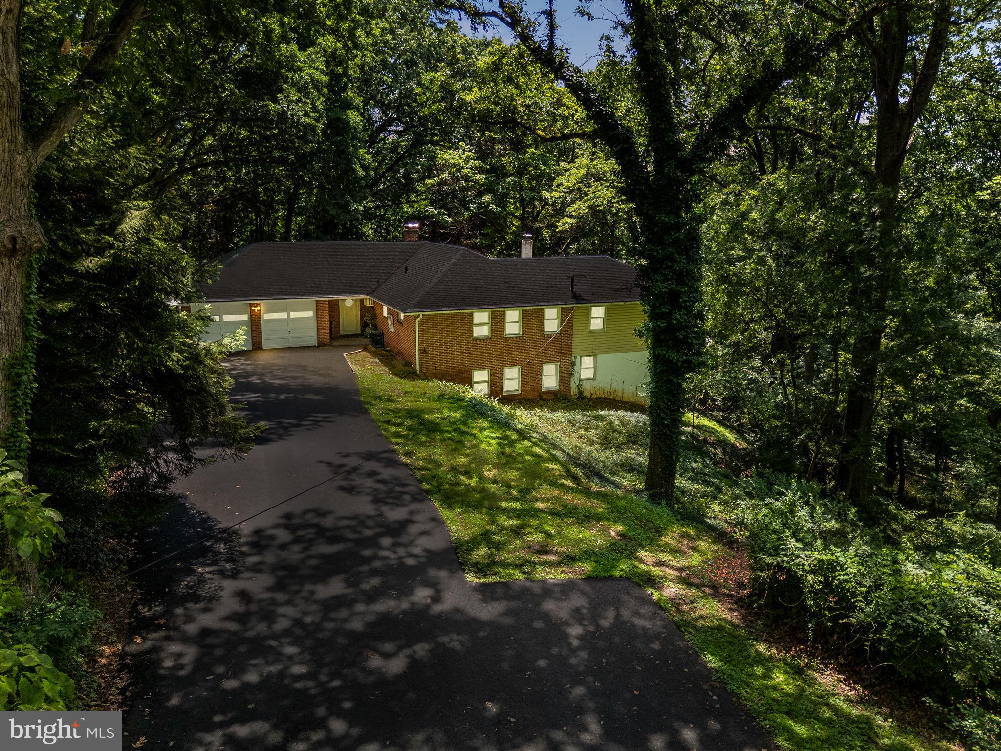 This unique one of a kind property is situated on over 2 private acres of prime real estate in desirable Upper Providence Township. Welcome into an open floor concept with breathtaking views of the surrounding lush green mature foliage. This home needs some updating but has all newer major systems. Four spacious Bedrooms, a dressing room, walk-in closet, three full bathrooms, two options for a primary en suite, one on each floor. Newer gourmet kitchen with built-in wine cooler (2018) Renovated Lower Level (2018) New Rain Gutter System (2019) New Insulation in Attic (2022) New High Efficiency Boiler with 5 zone system (2023) Newer High Efficiency 50 Gallon Hot Water Heater, Upgraded 200 AMP Electric Panel, Freshly Painted, Built-in Two Car Garage, Attached Greenhouse with pond. This home has to be seen to be fully appreciated. A short walk to desirable Glen Providence County Park and minutes from The Blue Route, downtown Media and great dining and shopping. Home is being sold as-is and is an excellent opportunity to own a private feeling oasis in the heart of Delaware County.