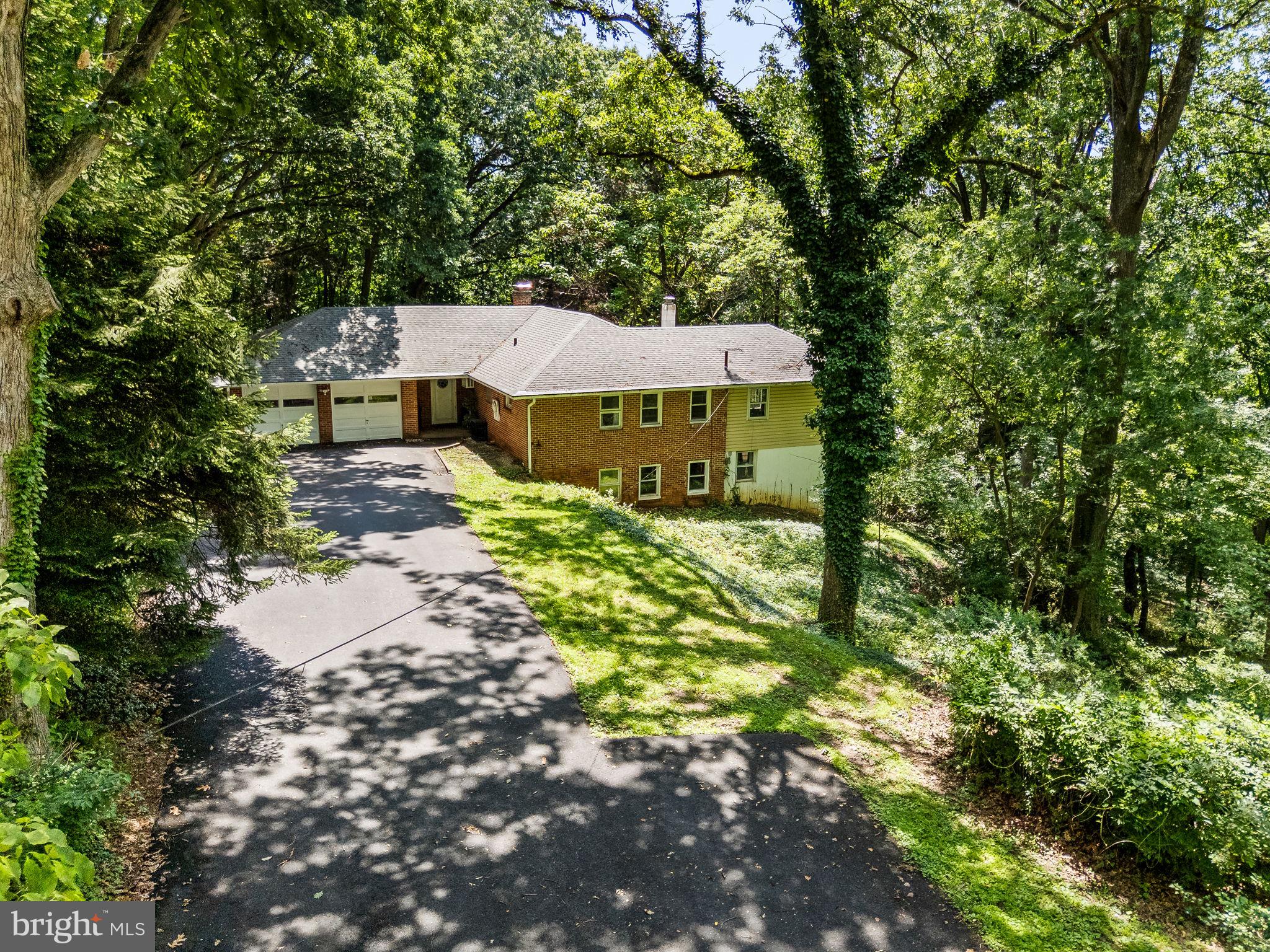 A unique opportunity to own a one of a kind property situated on over 2 private acres of prime real estate in desirable Upper Providence Township. Welcome into a open floor concept with breathtaking views of the surrounding lush green mature foliage. A one of a kind layout for a selective buyer. Four spacious Bedrooms, a dressing room, walk-in closet, three full bathrooms, two options for a primary en suite, one on each floor. Newer gourmet kitchen with built-in wine cooler (2018) Renovated Lower Level (2018) New Rain Gutter System (2019) New Insulation in Attic (2022) New High Efficiency Boiler with 6 zone system (2023) Newer 50 Gallon Hot Water Heater, Upgraded Electric Panel, Freshly Painted, Built-in Two Car Garage, Attached Greenhouse with pond. This home has to be seen to be fully appreciated. A short walk to desirable Glen Providence County Park and minutes from The Blue Route, downtown Media and great dining and shopping.