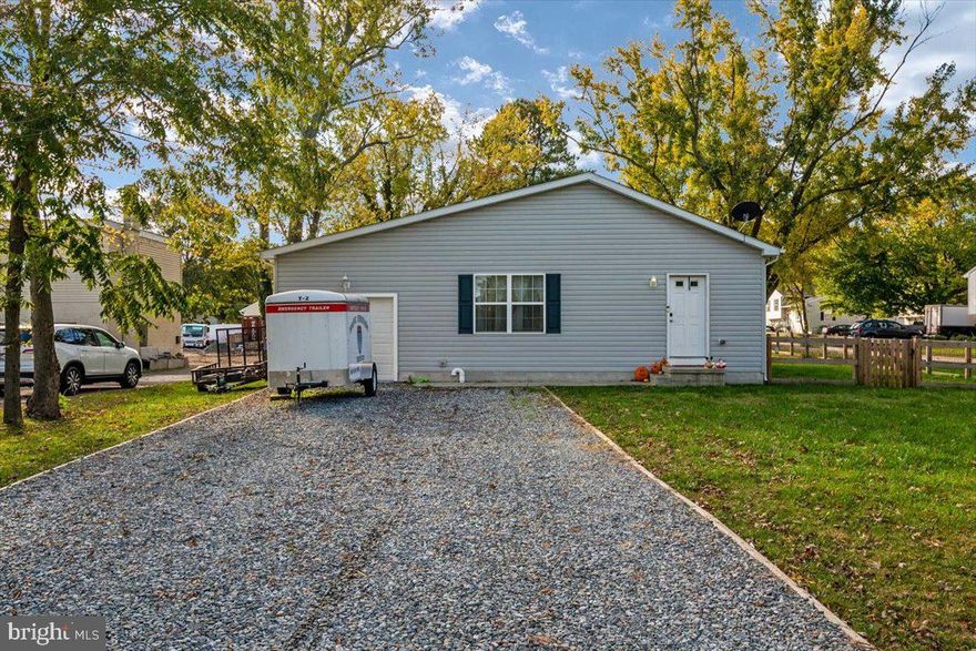 Welcome to 4402 Main St in the heart of Grasonville MD. You're going to love this 3 bedroom two bathroom rancher on almost half an acre! Built in 2016 this home is still like new! As you walk in you will notice the open concept between the living room, dining area, and kitchen! The kitchen features stainless steel appliances and granite countertops. This home features beautiful laminate hardwood flooring throughout the common areas and carpet in the bedrooms! As you make your way down the hallway you will notice two bedrooms on the right side of the hallway and a main bathroom to the left. As you enter the owner's suite you will notice access to the back yard and your own private bathroom! The home also features an attached 1 car garage and fully fenced in backyard! Zoned GVC you will have the opportunity for multiple uses of the property!