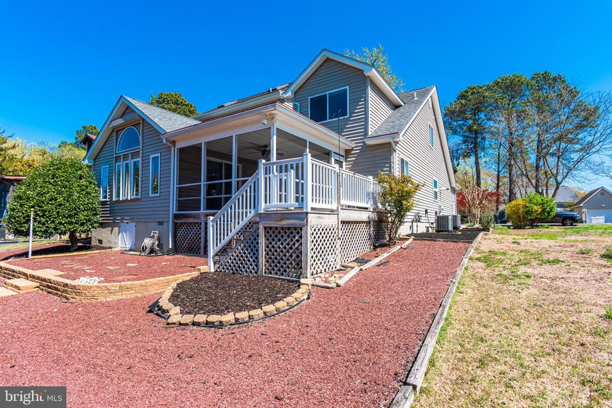 Seeking a WATERFRONT DREAM in the sought-out Ocean Pines Community, look no further! This one-of-a-kind, WATER FRONT features endless WATERFRONT views, enhanced with boat dock! So, enjoy boat access just minutes to the bay. 
This Stunning  GEM offers three bedrooms, and two full bathrooms, and a half bathroom.  This one is ready to enjoy!  Immaculate, well kept and shows pride of ownership.  
The spacious primary bedroom is enhanced with large sliding doors, enhancing natural sunlight that leads to the outside lounge area.  Sizable primary bathroom is equipped with a whirlpool bathtub, large shower, and double sink for convenience.  
Expansive open-concept space allows for dining and entertaining, while enjoying the beauty of the waterfront views with large custom windows, and plenty of sunshine.  Living Area is enhanced with astonishing vaulted ceiling, cabinet space as well as shelving for decor, and cozy fireplace.  
Kitchen is equipped with ample cabinet space, breakfast bar for added convenience, natural gas stove, and recess lighting.  Dining area features hardwood flooring.  
Bonus Sunroom is perfect to let the sunshine in, to relax and enjoy the natural light.  
Utility room features ample shelving and washer and dryer.
Second level features amazing extended loft overlooking the main living Area, to enjoy the custom vaulted ceilings and waterfront views.    Two nice sized bedrooms, and full bathroom.
Outside is ready to enjoy.  A sizable outdoor lounge area is the perfect place to enjoy the great outdoors and enjoy the shade while enjoying the water views.   Open deck, ready for grilling and entertaining.  
Low maintenance yard meticulously kept. 
RARE and desirable Over-sized garage!  
Ocean Pines Community is located just minutes from Ocean City, Maryland and the BEACH! Ocean Pines Beach Club is right in the town of Ocean City direct Ocean front on 49th St. So, pack your beach bags, and spend the day at the beach... Beach Club offers community parking, outdoor pool, volleyball even a restaurant and bar.... AT THE BEACH! What more could you ask for? The Community is Packed with amenities... features indoor and outdoor community pools, Community Center, Recreation and Parks. Ocean Pines Yacht Club, and Golf Course. The Ocean Pines Community has a community Police Department, and Fire Department within the Community. With restaurants, Ocean Pines Public Library, and Ocean Pines Post Office. Grocery Store and The Manklin Creek Shopping Center within the community. If you are looking for convenience, and seeking a beach retreat, or a place to call home, look no further.... This is it! Don't let this one get away, live the life you deserve!
