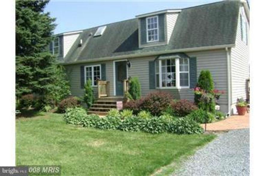 COUNTRY LIVING**COMPLETELY RENOVATED INSIDE & OUT! 2900+ SqFt.HOME , ALMOST 4 ACRES FEATURING 4 BD 2 BA EAT-IN KITCHEN w/BREAKFAST BAR & SS APPLIANCES, PLUS 1 BEDROOM 1 BATH IN-LAW SUITE w/ SEPARATE ENTRANCE**EXTRA LARGE DECK LEADING WITH TO IN-GROUND POOL** 2 CAR GARAGE**FRESHLY PAINTED AND NEW TILE & PERGO FLOORING