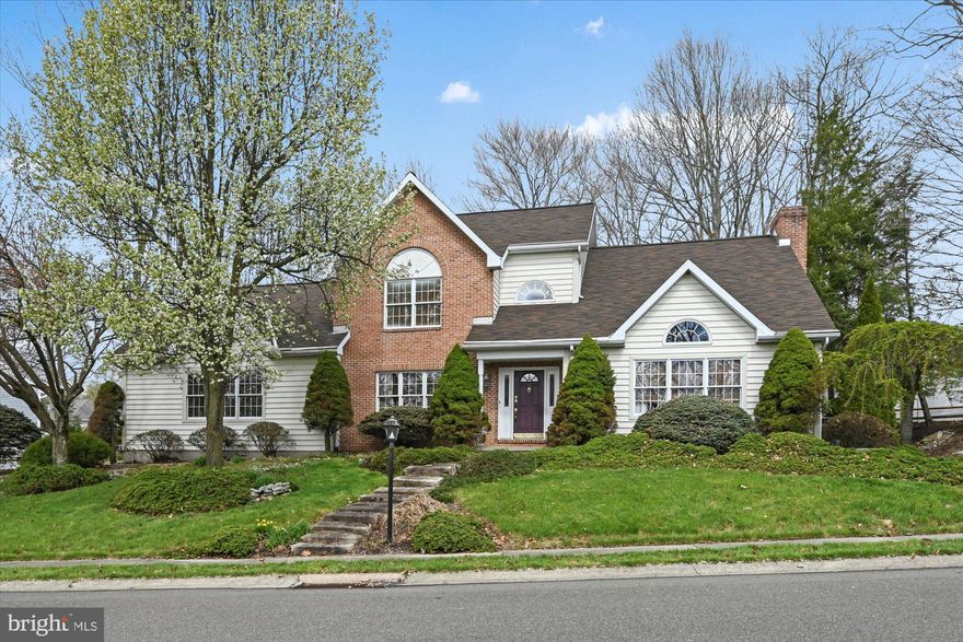 Eye catching Contemporary located within the desirable Norwegian Woods Development.   This home exudes a welcoming feel with its warm brick accents, paver walkway, unique exterior stone steps, and lush landscaping.    The spacious two story foyer is flanked by the formal living room with its impressive vaulted ceiling & the elegant dining room featuring decorative chair rail & crown molding.  Attractive hardwood flooring flows throughout most of the home.   A charming eat in kitchen features granite countertops, a tile backsplash,  center island, and a view of your beautifully landscaped private back yard.  Conveniently located laundry room, mud room, and two car garage off of kitchen.
There is plenty of space in the family room to entertain and enjoy the brick, wood burning fireplace.  The sunroom offers an abundance of natural light and a pool table for added enjoyment.  The second floor boasts a spacious primary suite, three additional nice size bedrooms, and a full bath.    The finished lower level creates an inviting living space perfect for enjoying time with family and friends.   Wet bar, full bath, exercise area, and an ample amount of storage space complete the lower level.  Desirable oversized 0.6 acre lot extends to Tall Oaks Drive.  Newer roof 2019.
