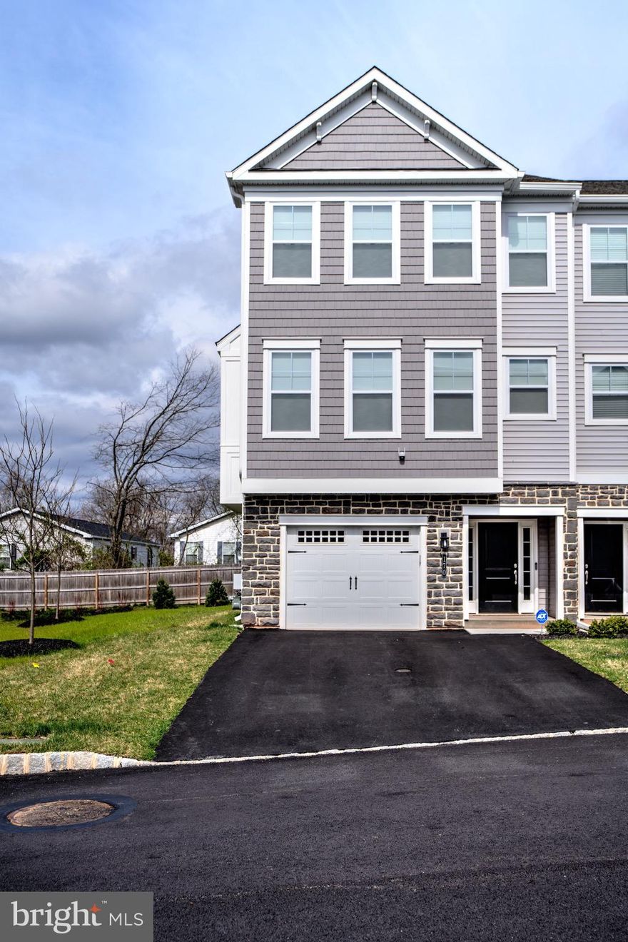 This home is a one-of-a-kind, upscale townhome currently on the market in the Everleigh community. It is  approx. 2,600 sq. ft. and has 4 bedrooms, 3.5 bathrooms, and an added 4th floor with a loft, dry bar, and a walkout rooftop/balcony. There is a 1.5 car garage (slightly bigger than a traditional 1 car garage for extra space on either side of parked car) and a 2-car, spacious driveway as the sidewalk is on the opposite side of the street. As you enter the front door into the foyer, you will be greeted with 8-foot ceilings, natural hardwood floors, and added recessed lighting, leading to the extended rear-foyer and patio door in the back. You will also note a coat closet in the foyer and an added Guest Suite with premium-padded carpeting, 2 connected closets and 1 full bathroom (soft-close cabinet/drawers) on the first floor. 

On the 2nd floor, you will walk onto natural hardwood floors, a very spacious, open-concept living room, kitchen and dining room with 9-foot ceilings throughout and lots of natural light from 10 windows. Access the deck, upgraded to Trex, through a single glass door right from the living room. Turn on the gas fireplace with a flick of a switch as you gather with friends/family in the living room. In the heart of the 2nd floor is the kitchen, with upgraded quartz countertops, an espresso-colored, 9-foot island, with extra island seating and upgraded pendant island lights, lots of cabinet space (white, soft-close), extended coffee section and additional white soft-close cabinets and quartz countertop, custom 8x24 tiled-backsplash and a spacious pantry. Enjoy all upgraded stainless-steel appliances, including a smart gas range, smart microwave (with an exhaust fan that vents directly outside), smart dishwasher, and a French-door fridge. Facing the front of the house is the dining room where you can fit a large dining table that can fit up to 10 people. The dining room also includes a box bay window area, exclusive to the Warwick end-unit model. There is also an additional closet on the 2nd floor followed by a half bathroom.

The 3rd floor welcomes you with 8-foot ceilings, premium-padded carpeting throughout, 2 additional bedrooms, 1 full bathroom in the hallway (upgraded quartz countertop, upgraded tiles, and soft-close cabinet/drawers) and a laundry room with a smart washer and dryer (with added white cabinets for extra storage). Additionally, there is a master bedroom that welcomes you with a 10-foot, vaulted ceiling, a full bathroom (upgraded quartz countertop, soft-close cabinets/drawers, and a breathtaking custom shower with 2 shower heads on opposite sides AND a rainfall shower, all 3 with customized controls) and a walk-in closet.

This home comes with an added 4th floor (with a separate Heating & Cooling zone) where you will walk onto natural hardwood floors, a 9-foot vaulted ceiling, a loft/entertainment/media area, a dry bar with a built-in wine/beverage cooler section, upgraded quartz countertop with espresso-colored, soft-close cabinets/drawers) and a rooftop/balcony with amazing day/night time views of the sky and beautiful sunset views.

170 Everleigh Dr is a 4-story, end-unit, upscale townhome located within Montgomery County in Royersford, PA, bordering Limerick, PA. It is minutes away from schools in the Spring-Ford district and essentially right outside of the King of Prussia area. In terms of recreation, leisure and transportation, this home is also minutes away from the King of Prussia Mall, Philadelphia Premium Outlets in Limerick, PA, public transportation access, and across the street from the Limerick Township Park.