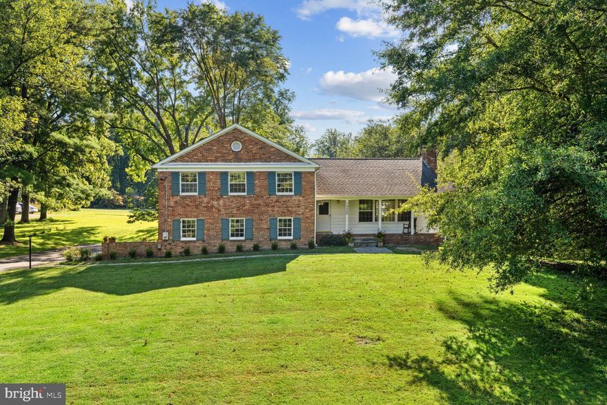 An incredible opportunity to own this premium 3.5 estate-quality acres in the heart of the Potomac Village. The picturesque site, with wide open frontage, sprawling lawns, and mature trees, provides an idyllic, tranquil setting. Build your dream home or renovate the existing brick house built in 1959. The main level of this charming 4-level split features large living with a fireplace, a separate dining room, a kitchen, and a front-to-to-back sunroom with three walls of windows overlooking gorgeous vistas. Upstairs there are four bedrooms and two full baths. A two-car garage, the fifth bedroom with a door to a patio, and a third full bath are located on the first lower level. The second lower-level features a large family room with a fireplace and a sliding glass door to the backyard, and a large storage area. A lovely front porch and a flagstone patio offering a spectacular view of the sunset sky, complete this charming home. The property is conveniently located in close proximity to the Village center and offers easy access to major commuting routes, three airports, the area's fine shopping, dining, schools, and wide range sports venues, cultural centers, country clubs, and parks. The property is eligible to connect to public water and sewer making it truly exceptional and rare opportunity to build your dream estate!