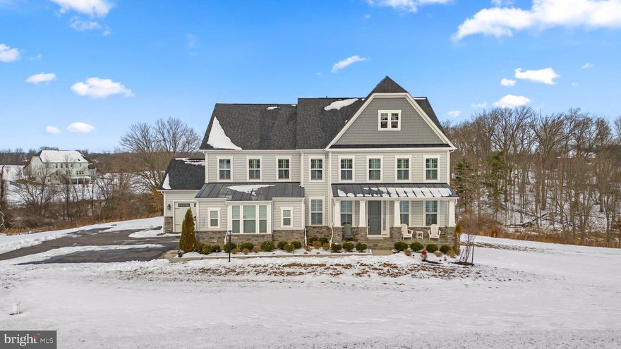 Welcome to luxury living in this meticulously crafted 5 bedroom home situated on a tranquil street. The study, just off the foyer, sets a tone of sophistication with built-in bookshelves and a French door entryway, enhanced by a transom above. 

The beautiful kitchen is a chef's delight with ambient lighting above the cabinets, discreet under-cabinet outlets, a custom backsplash, stainless steel appliances, soft-touch close cabinets/drawers, a gas cooktop, a double wall oven, sleek Quartz countertops, and a large center island with seating. The adjacent breakfast area enhances the culinary experience and has a French door that can lead to the deck of your dreams - the home is deck ready with a ledger board installed for a future custom deck.

The family room, adorned with a custom stone accent wall, is bathed in natural light through expansive windows. A main-level office provides an ideal workspace for those who work from home, complemented by a convenient half bath.

The second level hosts a spacious primary suite with a tray ceiling, upgraded carpet and padding, and an impressive custom California closet room. The ensuite bath boasts two vanities, a luxurious soaking tub, and a separate Roman shower. Additionally, the second level features a laundry room with a sink and three additional bedrooms— one with its own bathroom, and the others sharing a bathroom.

The expansive finished lower level, with custom shiplap walls, is an entertainer's dream. It includes a kitchen/bar with custom backsplash and a wine fridge, a full bath, and a door leading to the back yard. The premium lot backs to a wooded area, creating a private oasis.  Lounge by the pool of your dreams!  The back yard on this lot  is pool ready - no need for approval or a feasibility study! The upgraded front elevation with bump-outs and stone, extended driveway, and accent lights on timers contribute to the home's curb appeal.

Noteworthy features continue with garage space for three cars, two Ring cameras, custom plantation shutters on every window, dual-zone smart climate control, smart garage doors with keypads, and high-end flooring. The home is equipped with in-wall surround sound speakers in the basement, crown molding in the dining room and foyer, a mudroom entryway off the garages, and upgraded lighting and hardware throughout.

This home is not just a residence; it's a testament to meticulous attention to detail and unparalleled comfort. Schedule your visit today to experience the exceptional features and lifestyle this property offers. Welcome home!