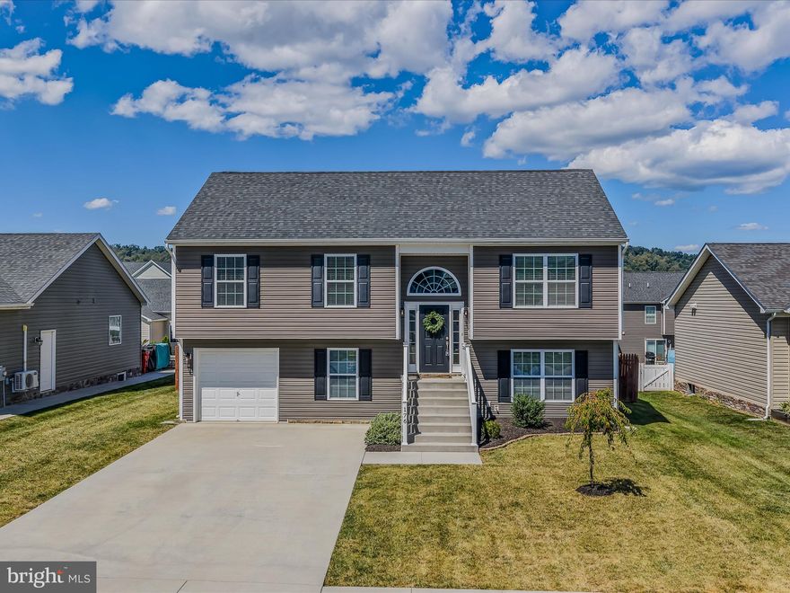 This stunning 5-bedroom, 3-bath split foyer in Martinsburg shows like a dream, fresh, modern, and move-in ready as if it were brand new! 
Built in 2017 and meticulously maintained, this home features spacious living areas filled with natural light, a bright open kitchen, and beautifully kept finishes throughout.
The thoughtful split-foyer design offers flexibility with three bedrooms on the main level and additional bedrooms and living space on the finished lower level, complete with its own exterior entry. With a total of five generously sized bedrooms and three full baths, there’s room for everyone, whether you need a home office, guest space, or growing family accommodations.
Step outside to your own private retreat. A 12×24 pool, fully fenced backyard, and plenty of space for entertaining or relaxing make it the perfect spot for summer fun or quiet evenings at home. An attached garage, durable vinyl siding, and efficient HVAC system add to the convenience and peace of mind.
Located in the desirable Red Hill Subdivision, this home offers a great commuter location with quick access to schools, shopping, and all that Berkeley County has to offer.
Don’t miss this move-in ready gem that blends comfort, functionality, and lifestyle!