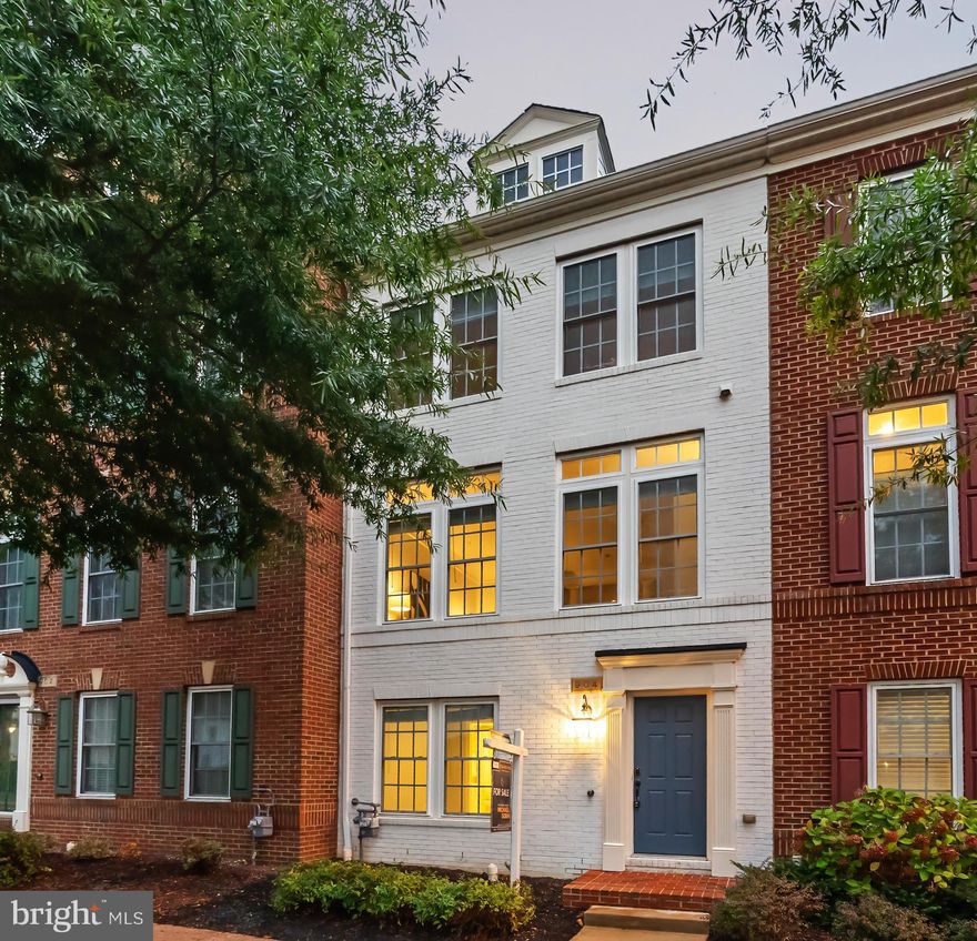 Welcome to this three-level townhouse offering 4 bedrooms and 3.5 baths with an open floorplan, high ceilings, and hardwood floors on the main level. The modern kitchen is designed with an island and bar seating, granite countertops, stainless steel appliances including gas cooking and a double oven, and space for both a dining table and a bar table. The living area features a fireplace, creating a comfortable setting for everyday living and entertaining.
The upper level includes three bedrooms and two full baths, highlighted by a spacious primary suite with a tray ceiling, walk-in closet, and a bathroom with a frameless shower, jetted tub, and dual vanity. The first upper level also includes a convenient half bath. On the entrance level, a bedroom and full bath provide flexible space for guests or a home office. The entrance level offers laundry and direct access to an oversized two-car garage in back, providing both secure parking and storage.
Set in Ellsworth Place, this home is close to DC, the Pentagon, Metro, Old Town Alexandria, Shirlington, and Del Ray, combining modern comfort with a sought-after location.