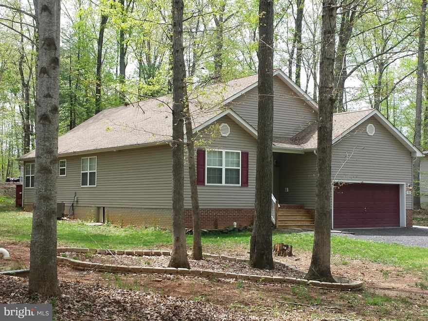 Light filled contemporary,one level living home has wrap deck with view of trees! This nearly 2100 SF home offers wood floors, FP, exceptionally large Master Suite with deck access. Exceptional Great Room with FP brings the outdoors in and makes a great place to relax or entertain in. Fresh paint, washer & Steam dryer, easily convertible 2 car garage currently serves as Theater Area. Stop by today