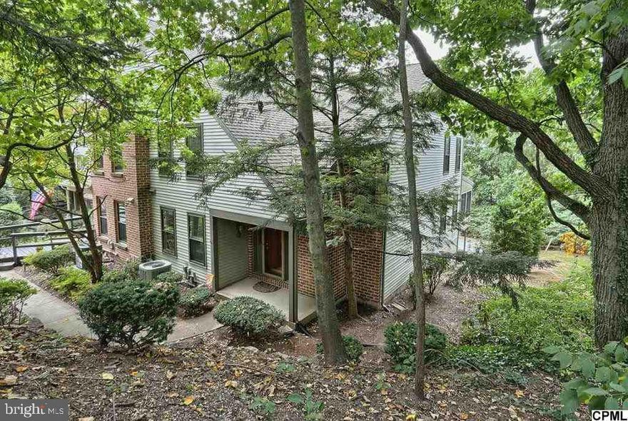 Immaculate end unit, 2-BR, 3 Bath townhome in wooded Oakmont.  Enjoy the fabulous views from the enclosed porch.  Upgraded kitchen with convenient pass-thru to dining room.  LL workout room/den and storage room with cabinets.  Bright MBR w/full bath and WIC.  Close to HMC.  A must see!