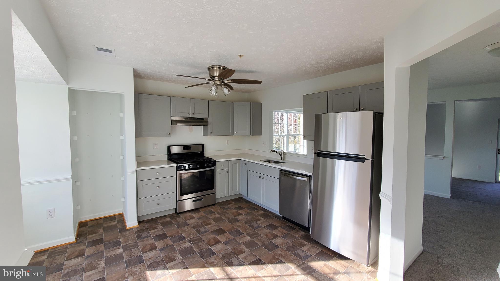 Move in ready!! You need to wait no longer to find the perfect home for you and your family. This end-unit townhouse has plenty of space for a growing family & potential work-from home space. The entire unit was fully renovated. Kitchen has all new appliances, gas stove, ss refrigrator, dishwasher, light gray cabinetry & white quartz countertop. Washer & dryer located in lower floor with a good size extra carpeted room that can be use as an office, entertainment room, family room, endless possibilities. The master bedroom located in the 3rd floor has it's own private bathroom & is fill with natural light. The other two bedrooms share a full bath located in the same 3rd floor. Be prepare to make your highest and best offer, talk to your agent & schedule a showing. You got this!!