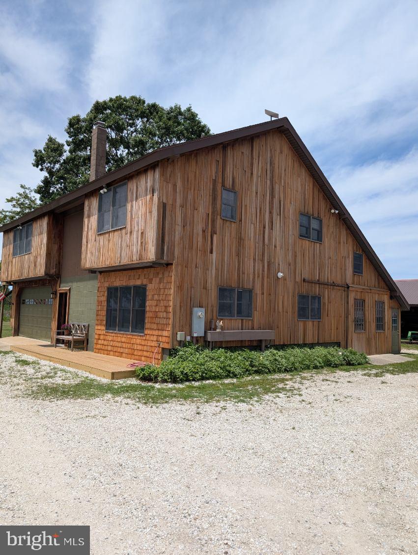 86-acre waterfront farm in the Neck District with a really nicely built lodge, two large outbuildings and a nicely appointed horse barn.