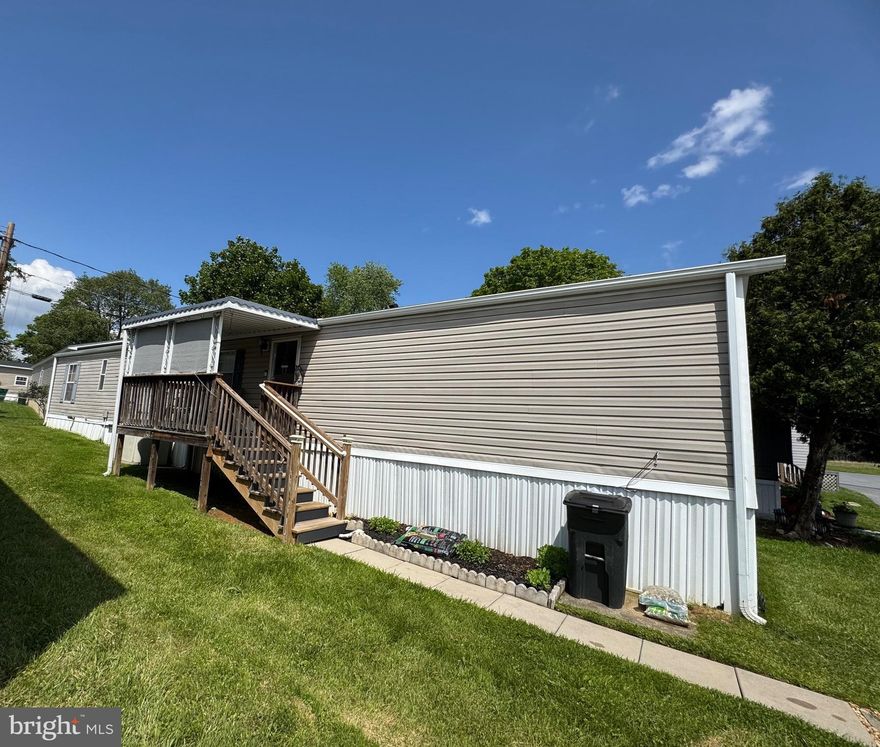 Affordable single level living!This well maintained 2003 Fleetwood home offers a spacious open rancher floorplan with a living room that opens to a spacious eat-in kitchen with sleek new appliances, gas for cooking, double sinks, built in microwave and a pass through to the living room area. Two bedrooms and two baths  each with its own full bath. Updates include: brand new carpeting, six month old roof, SS appliances and recent stairs.  Warm gas heat and Central air conditioning +ceiling fan for year round  comfort.  847s.f. Of living space conveniently located five minutes to shopping, restaurants, and more.
     $750 per month ground rent includes trash removal, water, and sewer, and snow removal on the street. *There is NO land for sale – lot size listed is the entire park. Property taxes shown are paid by park owner.*