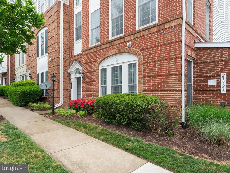 Welcome To Your New Home! Inside the Exclusive Gated Community of Potomac Club awaits 2392 Brookmoor Lane, a Stunning Brick 2 Level End Unit Townhouse-style Condo featuring 3 Bedrooms, 2 1/2 Baths, and a 1-Car Garage.  You will be welcomed with Natural Light coming through living room Plantation Shutters, impressed with a Spacious and Updated Kitchen and stunned by Beautifully Maintained Flooring, Triple Crown Molding and a Ceiling Fan for living comfort also make this home stand out. The kitchen boasts top of the line cabinetry, granite counters, recessed lighting, stainless steel appliances, a gas range and a double sink.  Hardwood Floors lead to the upper level with 3 spacious bedrooms to include a Large Primary Suite with recessed lights, ceiling fan and windows, windows, windows. The secondary rooms share a hall bathroom.  Laundry is on the bedroom level for convenience.  Guest parking is no issue with rear and front street options. 

Location is always a priority when purchasing real estate and this home hits all the marks with easy access to commuter routes and centrally located to both Ft Belvoir and Quantico military bases.  You will LOVE being in walking distance to Stone Bridge Potomac Town Center where you can enjoy the Wegmans, Starbucks, a move theatre and various retail shops and dining options.  Potomac Club is sought after not only for its guarded security gates, convenience and prime location but also its offering of up-scale amenities such as a state-of-the-art fitness center, clubhouse, basketball and multi-use courts, indoor and outdoor pools, game rooms, rock climbing walls, trails, sauna, and playgrounds.