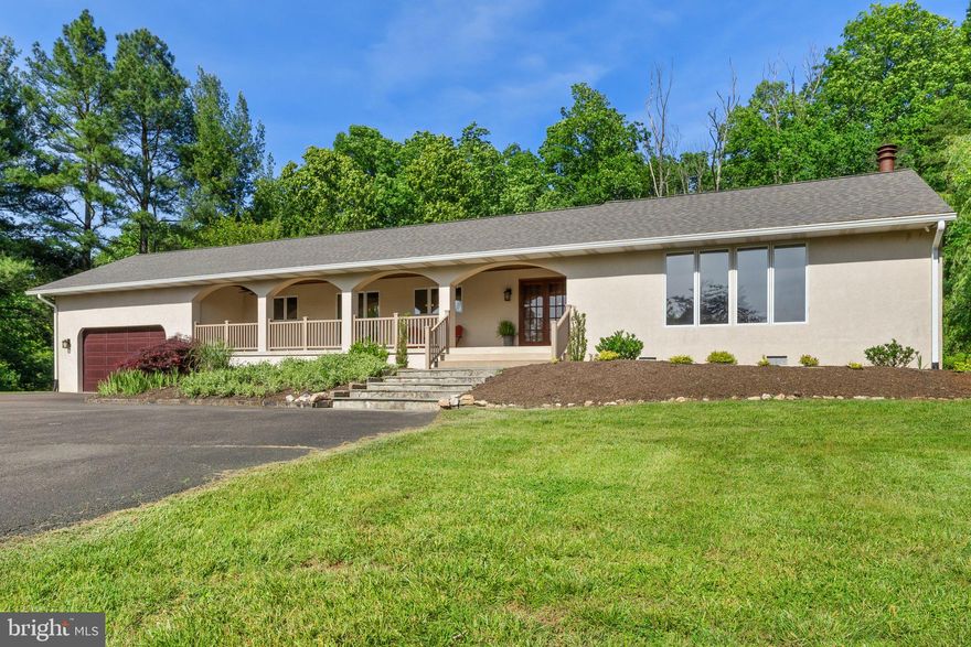 This super cool Mediterranean style ranch home will not disappoint!  Situated on a private, lush 2+ acre lot with gorgeous landscaping and scenic vistas.  You'll see the special features the minute you pull up to the expansive covered front porch.  As soon as you step inside the welcoming foyer you'll see how special this home is.  Immediately your eyes will be drawn to the beautiful family room which features a wall of built-in shelving and stone fireplace.  The inviting kitchen and breakfast nook provide views of the front yard.  The large dining room is something special with access to the deck and offers plenty of space for big gatherings.  The owners' suite, additional ensuite, 2 more bedrooms and full bath are located in the "east wing".  Multiple sliding glass doors open to an amazing center courtyard, complete with firepit.  This awesome outdoor space is one of the focal points of the home and provides a great space to host parties and large gatherings.  Adding to the special features is a main level laundry room, over-sized garage, extensive decking, partial basement, sought-after Kettle Run school district, high-speed Xfinity internet and main level living at its best!   NO HOA!!!  New Garage Door 2016, Both HVAC's replaced 2017, New Gutters & Gutter Guards 2019,  Replaced Roof 2023, Replaced Both Water Heaters 2024.  Replaced Insulation in Crawl Space  & throughout Attic 2024. 1,000 Gallon Propane Tank is owned.