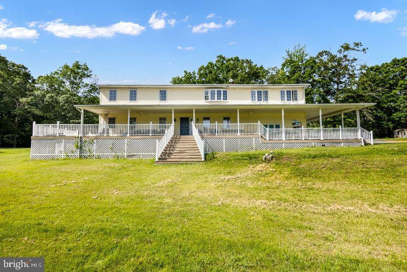 Beautiful, Spacious four-bedroom, 2.5 bathroom home on 2.5 +/- lot! Charles County, Maryland - Convenient access to Virginia & the District - Spacious, open floor plan, Additional lot of 5 acres adjacent to property being sold separately View will take your breath away! Beautifully covered wrap-around porch, Open floor plan, Gigantic living rooms, with potential for use as a game, media, or recreational space, Loads of details throughout this fabulous home custom ceramic tiled bathrooms with loads of accentuated details, Tray, vaulted and beamed ceilings, Lots of lighting, upper level Kitchen boasts granite counters, stainless steel appliances, beautiful new hardwoods. Spacious deck off kitchen with views of scenic yard Newer artesian well, cozy brick fireplace, wood burning stove & more
