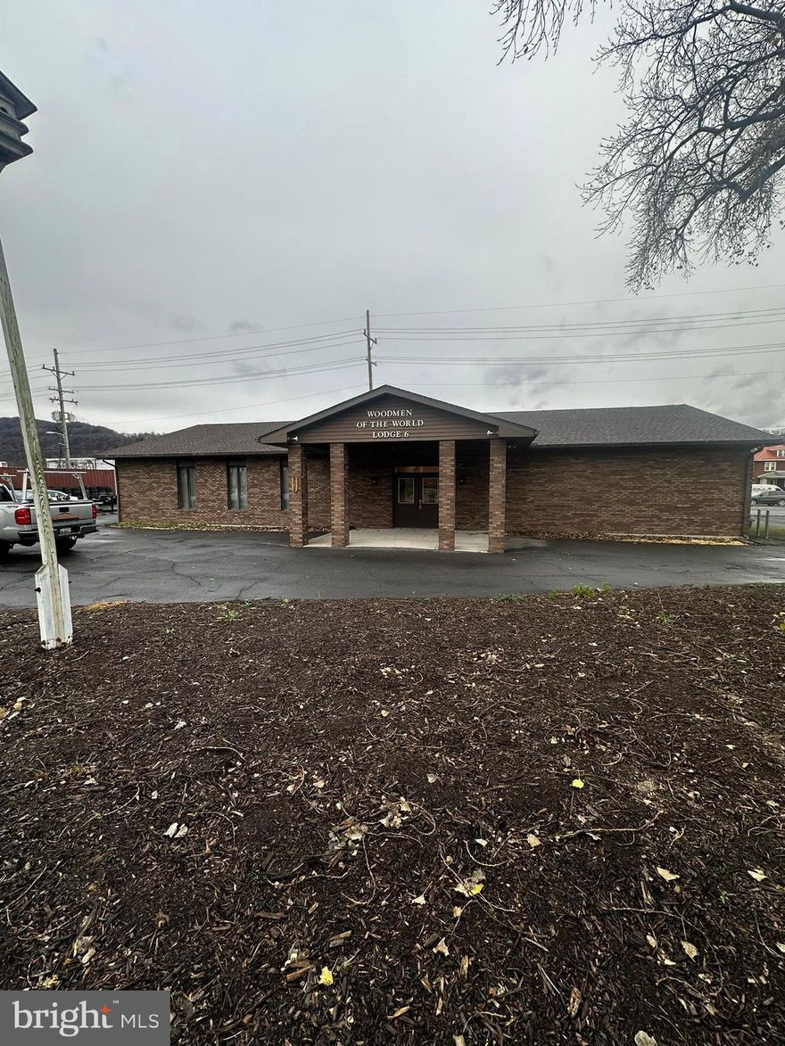 Seller Motivated!!! All brick building 1 owner 1 user 3,200 square feet 40 x 80' high quality built in 1995 lightly used by non-profit Woodmen of the World since they built it.  ADA Accessible (1995 codes)  Entrance hallways and restrooms.  40 x 40 meeting hall, large kitchen with commercial vent hood/ fire protection. Efficient Gas FWA with central Air (2 systems) LED Lighting Recent roof replacement. 32 Paved Parking Spaces with 4 curb cuts (2 on front 2 on side) Very good condition! As-Is but inspection clauses are welcomed.  3 flagpoles, very big tree. Opposite CSX Railroad Main Cumberland Shops and Yard entrance. Lots of traffic. This would be great for a small religious facility, health care, bar or restaurant, retail, day care, automotive, office, ...  Almost all furniture and fixtures could be included at the right price. 40 x 80  with no load bearing walls in most areas.