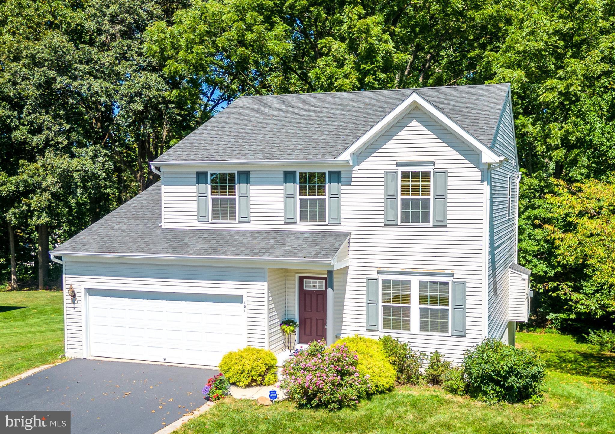 You CAN have it all! A spacious home in a vibrant community, yet backing to quiet, bucolic woods --- PLUS a Walk-Out Finished Basement; 4 Bedrooms; 2.5 Baths; and a 2-Car Garage! Welcome home to 181 Dague Farm Drive, in the sought-after Oakcrest community! Over the front porch, graciously accented by mature plantings & pink rose shrubs, and into the Reception Foyer replete with gleaming hardwood floors. These are the original owners --- such pride in ownership and meticulous care! The open lay-out and modern, inviting spaces include a large Living Room/Den, and the oversized Family Room which showcases a mantled Majestic direct-vent gas fireplace. Into the Eat-In Kitchen and you will discover the 2-tier Breakfast Bar peninsula; upgraded GE appliances; gas cooking; 42-inch raised panel Timberlake cabinetry; seemingly endless counter space; custom glass mosaic tile backsplash; dual bowl stainless steel sink & faucet; large walk-in pantry; extra recessed lighting; and hardwood floors. WOW!---the Morning Room is just stunning, with its hardwood floors; vaulted ceiling; abundance of natural light; and there are slider doors leading out to the expansive custom Deck with gorgeous vistas of the woods & open space beyond. The Laundry; Powder Room; and access into the oversized 2-Car Garage with electronic opener system complete this main level. Upstairs the Primary Suite is a true oasis --- large Bedroom; Walk-In Closet w/extra storage alcove; spa-inspired Full Bath with dual sink vanity, luxurious soaking tub, and stall shower. Down the hall are 3 more Bedrooms (use one as an Office!) all with ample closets, and a Full Bath with tub/shower combo. NEW carpeting (August 2023) in the Walk-Out Finished Basement, and also raised ceilings; recessed lights; and so much storage. This level was intentionally designed to include a room w/egress window that could become the 5th Bedroom or Bonus Room, and a room plumbed for another Bathroom…..perhaps an In-law Suite awaits? Just needs your imagination and finishing touches! Do not miss the slider doors that lead out to the flat, grassy yard and woods --- with a natural pathway leading into a serene little glade! Such scenic yards offering beautiful, tranquil privacy for you! This EnergyStar certified energy-efficient home has also been enhanced by the owners with gutter guards; water softener; a custom shed; newly sealed driveway; AND BONUS --- a one-year AHS ShieldComplete Home Warranty (their highest level of coverage!) is included and is extra peace-of-mind for you! The Oakcrest sidewalk community is so close to recreation centers; shopping; restaurants, plus minutes to the Route 30 By-Pass, train stations, Downingtown and West Chester and everywhere you want to be! Some photos virtually staged.