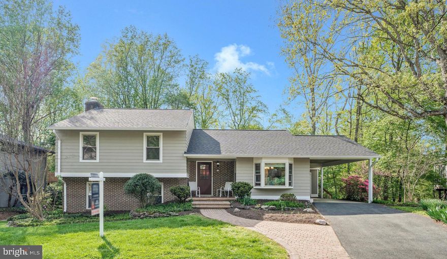 Don't miss this lovely home nestled deep into a highly desirable neighborhood in NE Vienna. You can move right in and live amongst the tree tops on a rarely available, .29 acre lot, backing to acres of gorgeous parkland. Steps to the trail leading to the W&OD Trail and the Town of Vienna shops and restaurants, beautiful historic Church Street in downtown Vienna, Glyndon Park and more. Wolftrap Elementary, Kilmer Middle and James Madison High School! You really can have it all with this four bedroom, three full bathroom home loaded with charm and character.  Well maintained home with exceptional natural light and stunning views from the living and dining rooms, patio and the expansive deck.  Close to Metro/Tysons/Reston/DC/ and Wolf Trap Performing Arts Center! Hardwood floors on main level and stairs.  The remodeled kitchen has a large center island, stainless steel appliances, an abundance of cabinetry, recessed lighting, granite countertops and is the heart of this home. Living room and Dining room have access to two sliding glass doors leading to a large composite deck with STUNNING views of mature trees and acres of parkland, perfect for relaxing or entertaining.  The transition from the interior of the home to the exterior is nothing short of rare and oh so special. The upper level has a sizable Primary bedroom suite with an en-suite bathroom, two additional bedrooms and a full hall bathroom. New carpet installed in all four bedrooms and landing. Fresh interior paint throughout. The lower, walk out level has an oversized fourth bedroom, a Family room with a wood stove, a laundry room and a third full bathroom. The Family room has built in shelving and a sliding glass door with access to a patio with stairs leading up to the deck. The floorplan and flow of this home is wonderful. Kitchen door allows for access from kitchen to carport and shed with steps leading to the deck. YOU WILL LOVE IT HERE! Very private, quiet living opportunity. Charming curb appeal, just a few homes away from a Cul de sac location, walkable to Wolf Trap ES. Tysons Corner /495/66/ and Toll Road are all 3-3.5 miles away. Some of the many upgrades: New roof (2021), James HardiePlank siding (2021), Heat Pump (2022), Hot Water Heater (2022), ProVia Bay Window and secondary window in kitchen (2021), front walkway (2021), range and microwave (2025), refrigerator (2022), new electrical junction box  and EV Charging Station (2023), whole house surge protector, JES crawl space encapsulation with dehumidifier (2021) and so much more!! Hurry, don't miss this one! Open House Saturday April 26, 2-4 and Sunday April 27, 1-4PM