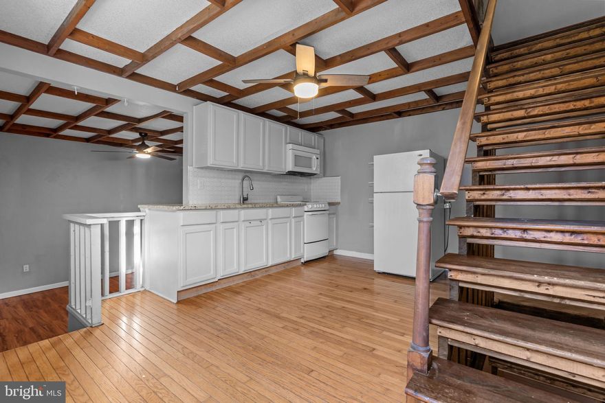 Welcome to 1117 Morris Street, a beautifully updated two-bedroom, one-bath home located just a block off 12th and Passyunk in one of South Philadelphia’s most desirable neighborhoods. This home seamlessly blends timeless South Philly character with tasteful modern updates and design features throughout.

The main level showcases rich hardwood floors, high ceilings, and an inviting open layout that flows effortlessly from the living area into the dining space and modern kitchen. The kitchen is a true showpiece, highlighted by solid stone countertops, updated cabinetry, and a custom wood-designed ceiling that adds warmth, depth, and architectural detail. Every element combines style and function, creating an ideal space for cooking, entertaining, and everyday living. A brand-new hot water heater provides comfort and efficiency for years to come.

Upstairs, you’ll find two well-sized bedrooms that feature very high ceilings, giving the spaces a bright, open, and grand feel. Each bedroom has been recently updated with new ceiling fans and light fixtures, enhancing comfort and adding a touch of modern sophistication. The full bathroom has also been beautifully renovated with a sleek stall shower, stylish tilework, and contemporary fixtures. A brand-new washer and dryer remain with the property, offering added convenience for the new homeowner.

The finished basement provides excellent versatility and can serve as a second living room, home office, gym, or recreation area—an ideal extension of the home’s living space. Throughout the property, tall ceilings, neutral colors, and thoughtful updates create a sense of openness, light, and move-in-ready appeal.

Location, location, location! Situated in the heart of Passyunk Square, this home offers unbeatable access to one of Philadelphia’s most vibrant and walkable corridors. East Passyunk Avenue is just steps away, lined with some of the city’s top dining destinations, cafés, and boutique shops. Local favorites include Cantina Los Caballitos for authentic Mexican fare, Barcelona Wine Bar, Le Virtù, and Bing Bing Dim Sum. The neighborhood also offers cozy coffee shops, bakeries, fitness studios, and locally owned stores that contribute to its distinctive community charm.

Outdoor amenities are abundant, including Columbus Square Park at 12th & Wharton, offering open green space, playgrounds, and recreation areas, as well as the Singing Fountain, a beloved neighborhood landmark and gathering spot. Commuters will appreciate quick access to I-95, I-76, and nearby SEPTA Broad Street Line stations at Tasker-Morris and Ellsworth-Federal, providing easy travel to Center City and beyond.

Passyunk Square is also home to popular annual events that showcase its strong neighborhood spirit, such as the Passyunk Passeggiata summer evening series, East Passyunk Fall Fest, and the South Philly Sausage Fest, all celebrating local food, music, and community.

Combining classic style, modern comfort, and a prime location, 1117 Morris Street offers a rare opportunity to own a truly special South Philadelphia home. With its distinctive design touches—including the custom wood kitchen ceiling—plus updated systems, a finished basement, and proximity to top restaurants and amenities, this property delivers the very best of city living.