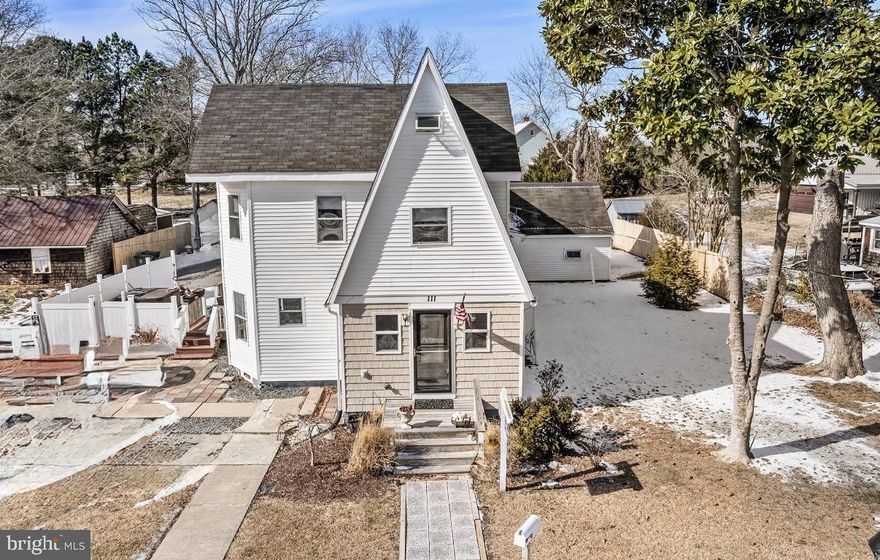 Charming Coastal Farmhouse with land, in Downtown Berlin area on Branch Street!  You won't want to miss this opportunity to own such a Unique property on over.48 acre level land in the Coolest Small Town of Berlin! In walking distance to Downtown attractions!   The home has  been updated with * New Flooring* * New Kitchen** Newer Bathes**
This home has many features that you don't get with many homes of this age.  It is a 1910 built farm-house style home in the heart of Berlin that features 4 upstairs Bedrooms, 2 laundry facilities, 3.5 Bathrooms and very spacious downstairs living area! In-Law Suite or Office or Art Studio attached with separate entrances.  Side entrance way with Privacy Fence surrounds a Courtyard/Porch area featuring a Jacuzzi Hot tub! There is much more potential with all the useable land and a long driveway with plenty of parking for 6+ cars. 2 sheds one attached and one outbuilding.  If you know Berlin, this has the " Old School Charm" with a Modern spin!   This is a great opportunity and will go fast!  Very Clean and well maintained.  Schedule now to see in Person!