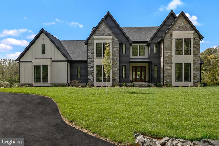 Experience next-level luxury living in this new construction, energy-efficient estate in Clifton, Virginia, set on a private 5-acre wooded lot with over 7,100 square feet of refined living space.

Built in 2025, this Energy-Star certified, Net Zero-ready home combines top-tier craftsmanship with cutting-edge efficiency, something rarely found in Northern Virginia luxury homes.

Inside, you’re immediately greeted by soaring ceilings, wide-plank flooring, and natural light pouring through oversized windows. The designer kitchen is built to impress, featuring quartz countertops, premium Dacor appliances, and custom cabinetry, making it the true centerpiece for both everyday living and entertaining.

The main-level primary suite delivers a true retreat with a spa-inspired bathroom, soaking tub, walk-in shower, and expansive closet space. Upstairs and throughout the home, generously sized bedrooms and ensuite baths provide both comfort and privacy.

The finished lower level adds flexibility with additional rooms ideal for a home gym, guest suite, office, or media space, perfect for today’s lifestyle.

What truly sets this home apart is the combination of:

-Net Zero-ready construction and advanced HVAC design
-5 acres of privacy in sought-after Clifton
-Modern luxury finishes paired with long-term efficiency
-New construction without the wait

Located just minutes from major commuter routes while still offering complete privacy, this home delivers the rare balance of seclusion, convenience, and top-tier build quality.