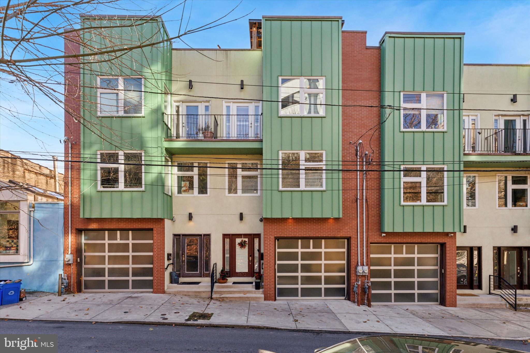 Prepare your eyes for the best views in the city! Nestled on a one-way street in the heart of Manayunk, this sun drenched and stunning 3-bedroom, 3.5-bath modern home offers the perfect combination of style, comfort, and functionality. From the moment you step inside, you'll be captivated by the warm elegance of the hickory wood floors, huge windows, and the thoughtfully designed spaces throughout. 

The first-floor bedroom features a versatile Murphy bed with attached bookshelves, offering flexibility for a guest room, office, in-law suite, or cozy retreat. There is an adjacent full bath, coat closet, as well as access to the large garage and mechanical closet. 

Heading up to the second floor, the family room is equally inviting with additional built-in shelving, ideal for showcasing your favorite books and décor. Custom window treatments throughout the home add a touch of sophistication while offering both privacy and light control. The gourmet kitchen is a chef’s dream, boasting granite countertops, a wine fridge, pot-filler faucet, and brand-new black stainless steel appliances that perfectly complement the sleek, modern aesthetic. 

Going up to the third floor, the huge primary bedroom has stunning views with an en suite bath. Another spacious bedroom, full bath, and laundry area complete this level. 

When it’s time to unwind or entertain, head up to the expansive roof deck, where you’ll find spectacular 360-degree views of Manayunk and the lights of center city—a perfect spot for morning coffee, evening cocktails, or hosting gatherings. Conveniently located on a quiet street with ample parking, this home combines tranquility with accessibility to all the dining, shopping, and entertainment options that make Manayunk so desirable. You're a five minute walk from Main Street Manayunk, multiple bus lines, and less than ten minute walk to the Manayunk train stop! 
Schedule a showing today!