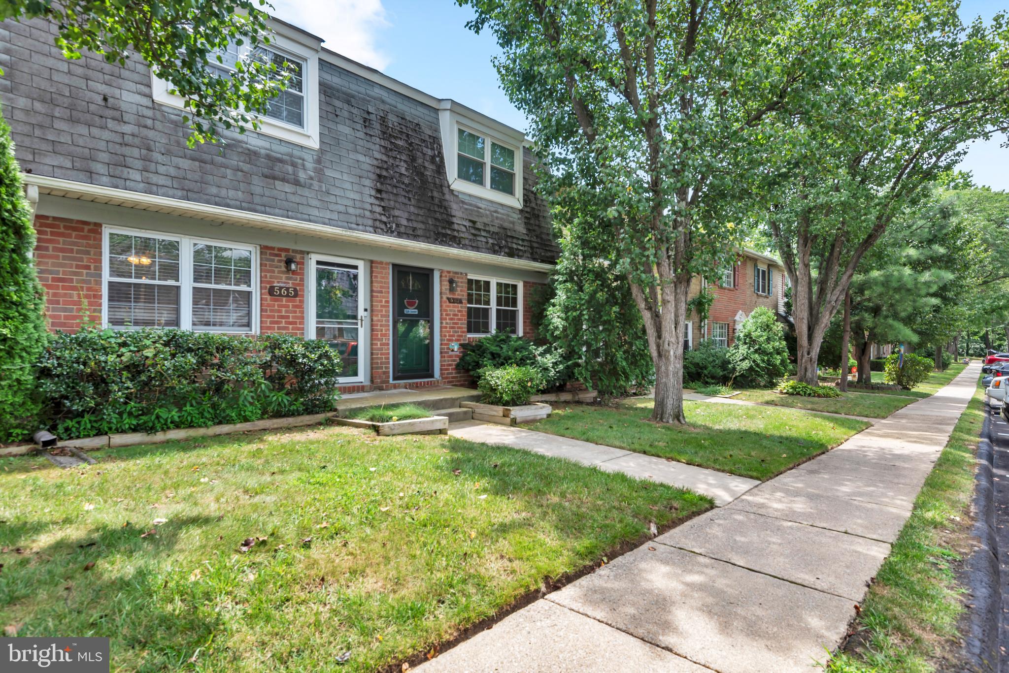 Welcome to 565 Belmawr Place — an incredible opportunity tucked away in a peaceful and well-maintained Sussex Square community in the heart of Anne Arundel County! This charming brick-front home offers the perfect combination of value, convenience, and comfort. Step inside to find a light-filled living space with fresh paint, updated flooring, and thoughtful touches throughout. The beautifully updated kitchen is a standout feature, with granite-look countertops, sleek stainless steel appliances, and ample cabinet space for all your culinary needs. Just off the kitchen, sliding glass doors lead to a quiet back patio — perfect for your morning coffee or a relaxing evening outdoors. Upstairs, you'll find generously sized bedrooms and a full bath, creating a cozy retreat at the end of the day. The full bathroom has been tastefully updated with a granite vanity, modern lighting, and a sleek shower/tub combo. The in-unit laundry area is conveniently located on the main level, and features a full-size stacked Samsung washer and dryer plus a charming decorative shelf — where function meets personality! The hot water heater was replaced in 2023, offering peace of mind for years to come. Parking is a breeze thanks to your assigned parking space directly in front of the home — and there's plenty of visitor parking nearby for your guests! The neighborhood is tucked away from the hustle and bustle, yet you're just minutes from shopping, dining, commuter routes, and everything Millersville has to offer -- all at an exceptional price point. 📍 Schedule your showing today and envision the possibilities!