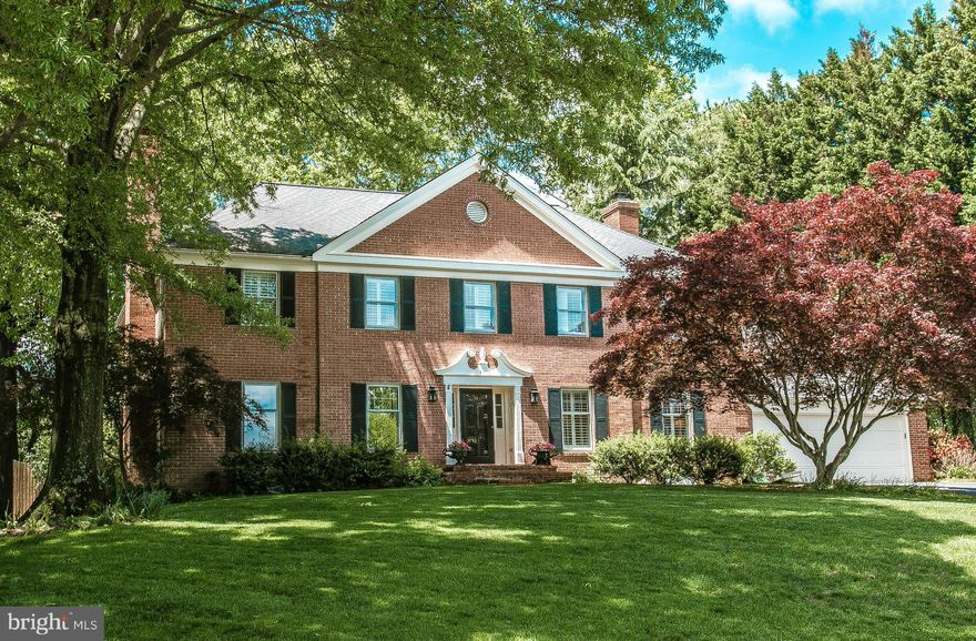 Stately all brick colonial on cul de sac backing to acres of green space & trees * Over 5000 sf of living on three levels * Renovated & expanded gourmet kitchen with top of the line appliances & adjoining breakfast nook & family room with walls of windows * Three fireplaces * Custom built-in cabinetry in several rooms * Master Bedroom with new marble bath * Expansive rec room with English bar *