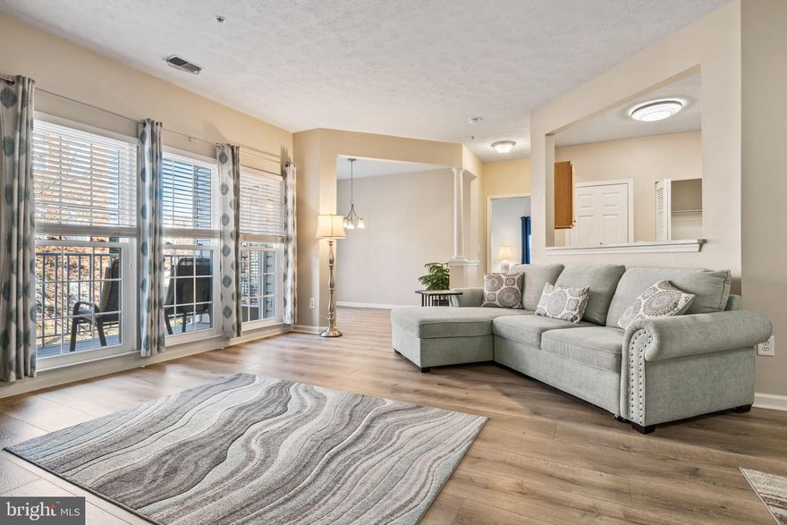 **OPEN HOUSE SATURDAY 2-28-26 FROM 12PM-2PM**Welcome home to this well-maintained second-floor condo offering over 1,300 square feet of finished living space in the highly desirable, secure Devonshire community, complete with elevator access. This brick-front, garden-style residence features 2 spacious bedrooms, 2 full baths, and a versatile bonus den, all designed for comfortable, low-maintenance living. From the moment you enter, you’ll appreciate the open-concept layout and beautiful luxury vinyl plank flooring that is both water- and scratch-resistant. A large storage closet and separate coat closet flank the entry, providing excellent everyday functionality.

The fully updated kitchen is thoughtfully designed and equipped with stainless steel appliances including a gas range, quartz countertops installed in 2021, and rich maple cabinetry featuring pull-outs, a lazy Susan corner cabinet and under cabinet lighting. A large pantry and a full-size washer and dryer are conveniently located within the kitchen area, making daily living effortless. The bright and inviting living area is filled with natural light and flows seamlessly into a bonus den that works perfectly as a dining space, home office, or flex area. Step outside to the private balcony, complete with a sliding screen, overlooking a peaceful common area. The balcony was upgraded with new composite decking in 2023 and also features a custom roll-down shade and a utility closet for additional storage.

The spacious primary bedroom offers newer carpet installed in 2022, newer blinds from 2023, and two closets, including a walk-in closet and a second mirrored closet. The primary bathroom features double sinks, a large vanity mirror, a generous linen closet, and a walk-in shower with built-in seating and safety grab bars. On the opposite side of the unit, the second bedroom also features newer carpet and has direct access to the second full bath, which includes a linen closet and a tub/shower combination.

Additional updates and highlights include all new double-hung windows installed in 2021, HVAC replaced in 2019, new smoke detectors in 2021, newer light fixtures, new blinds throughout, and all appliances replaced in 2018. The condo includes one assigned parking space with ample guest parking available. Monthly condo dues of $340 cover water, sewer, trash, snow removal, common grounds maintenance, management, reserve funds, and exterior building maintenance. Ideally located just minutes from shopping, dining, and medical facilities, with easy access to I-695 and I-95, this home offers true maintenance-free living in a beautiful community. Condos in Devonshire are in high demand, so don’t miss your opportunity—check out the 3D virtual tour and schedule your exclusive showing today.