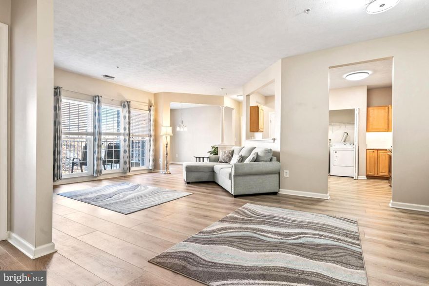 **OPEN HOUSE SATURDAY 2-28-26 FROM 12PM-2PM**Welcome home to this well-maintained second-floor condo offering over 1,300 square feet of finished living space in the highly desirable, secure Devonshire community, complete with elevator access. This brick-front, garden-style residence features 2 spacious bedrooms, 2 full baths, and a versatile bonus den, all designed for comfortable, low-maintenance living. From the moment you enter, you’ll appreciate the open-concept layout and beautiful luxury vinyl plank flooring that is both water- and scratch-resistant. A large storage closet and separate coat closet flank the entry, providing excellent everyday functionality.

The fully updated kitchen is thoughtfully designed and equipped with stainless steel appliances including a gas range, quartz countertops installed in 2021, and rich maple cabinetry featuring pull-outs, a lazy Susan corner cabinet and under cabinet lighting. A large pantry and a full-size washer and dryer are conveniently located within the kitchen area, making daily living effortless. The bright and inviting living area is filled with natural light and flows seamlessly into a bonus den that works perfectly as a dining space, home office, or flex area. Step outside to the private balcony, complete with a sliding screen, overlooking a peaceful common area. The balcony was upgraded with new composite decking in 2023 and also features a custom roll-down shade and a utility closet for additional storage.

The spacious primary bedroom offers newer carpet installed in 2022, newer blinds from 2023, and two closets, including a walk-in closet and a second mirrored closet. The primary bathroom features double sinks, a large vanity mirror, a generous linen closet, and a walk-in shower with built-in seating and safety grab bars. On the opposite side of the unit, the second bedroom also features newer carpet and has direct access to the second full bath, which includes a linen closet and a tub/shower combination.

Additional updates and highlights include all new double-hung windows installed in 2021, HVAC replaced in 2019, new smoke detectors in 2021, newer light fixtures, new blinds throughout, and all appliances replaced in 2018. The condo includes one assigned parking space with ample guest parking available. Monthly condo dues of $340 cover water, sewer, trash, snow removal, common grounds maintenance, management, reserve funds, and exterior building maintenance. Ideally located just minutes from shopping, dining, and medical facilities, with easy access to I-695 and I-95, this home offers true maintenance-free living in a beautiful community. Condos in Devonshire are in high demand, so don’t miss your opportunity—check out the 3D virtual tour and schedule your exclusive showing today.