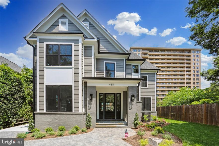 100% Completed! LOCATION, LOCATION, LOCATION!!! City living at it’s finest! The best location in Bethesda featuring an incredible view of the Downtown Bethesda skyline and just steps away from everything it has to offer! Spectacular home built by award-winning Douglas Construction Group (Best Green Builder-Bethesda) and designed by Studio Z Architects. This home features all of the modern luxuries you come to expect from a Douglas Construction Group home. 5 bedrooms, 5.5 bathrooms and 4 levels with amazing upgrades and finishes! Enjoy all of the fine details from high ceilings, hardwood floors, custom fixtures and recessed lighting. The main level includes a gourmet chef's kitchen with Wolf gas range and hood, Sub-Zero refrigerator with decorative panels, dishwasher, two ovens, tile backsplash, quartz countertops, center island, spacious breakfast area, family room with stone fireplace flanked by built-ins, gorgeous oversized dining room, a private office and a powder room. Adding to the contemporary conveniences of the first floor are a spacious mudroom with cubbies, hooks and bench and a butler’s pantry with a wine refrigerator and floor to ceiling custom cabinets for storage. Covered flagstone porch with gas fire feature and heater overlooking the rear fenced yard.  Upper Level I has 3 bedrooms, 3 full bathrooms, and a large laundry room. The owner’s suite includes expanded sitting area, dual custom walk-in closets and a spa bath with dual sinks, free standing soaking tub and a separate oversized glass enclosed shower. Upper Level II features a large bedroom, full bathroom and a Family/Homework-Study area. On the lower level there is a recreation room with dry bar, exercise room, bedroom, full bathroom storage room and luxury vinyl flooring throughout. Garage and oversized Paver driveway with off street parking for 3 cars. This home is part of the Bethesda Chevy Chase High School Cluster.