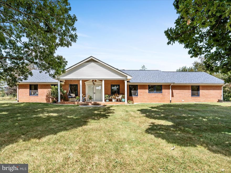 Welcome to 116 Rehoboth Ln, a timeless all brick rancher perfectly situated on 4.51 acres of serene, private land. With no HOA restrictions, this property offers the freedom to expand, garden, build, or simply relax in nature’s peace and quiet. You will love the charming front porch, ideal for morning coffee, and the spacious rear patio that opens to your private acreage, perfect for hosting friends or soaking up the countryside views. Car lovers and hobbyists will appreciate the oversized 2 car attached side entry garage along with a separate 2 car detached garage, offering ample space for vehicles, tools, or a workshop.

Inside, this home features 3 bedrooms and 3 full bathrooms, providing generous space for family and guests. The inviting living room boasts a cozy brick wood burning stove and beautiful hardwood floors that flow seamlessly into the dining area. The kitchen opens to the dining room, creating a warm and functional layout ideal for everyday living and entertaining. Laundry is conveniently located on the bedroom level. A full unfinished walk-up basement provides incredible potential for storage, a future living area, or even a custom space to suit your lifestyle. 

Whether you are searching for a peaceful retreat, a place to start your homestead, or simply a spacious property with flexibility and charm, 116 Rehoboth Ln checks every box. Come experience classic comfort, open skies, and endless possibilities.