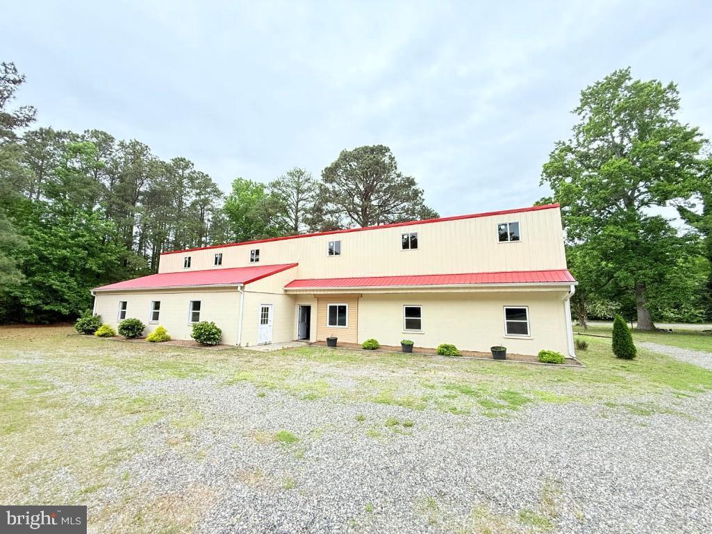 Prime commercial building offering 7,600 sq ft on 0.75 acres with exceptional 200+ ft road frontage on two sides along busy Richmond-Tappahannock Highway (Route 360). Built in 1950 with major renovation in 1975 and recent updates including new metal roof, siding, and plumbing. Features 3,825 sq ft of heated/cooled space with open floor plan, concrete flooring, brand new upstairs area, well water, septic system, and 3-phase power already installed. Solid concrete block construction with flat usable lot providing excellent parking potential. High-traffic location sees 15,000-20,000 vehicles daily with outstanding visibility from multiple directions. Strategically positioned between Richmond (45 miles) and Tappahannock (15 miles) in growing commercial corridor. Zoned for general business use, perfect for manufacturing, custom body shop, warehouse, contractor operations, retail, or mixed-use development. King and Queen County offers business-friendly environment with competitive tax rates and active economic development support. Property serves local market across Essex, King and Queen, and King William counties with limited comparable inventory available. Excellent investment opportunity in developing Route 360 commercial district with reasonable acquisition costs and strong potential for various commercial applications.