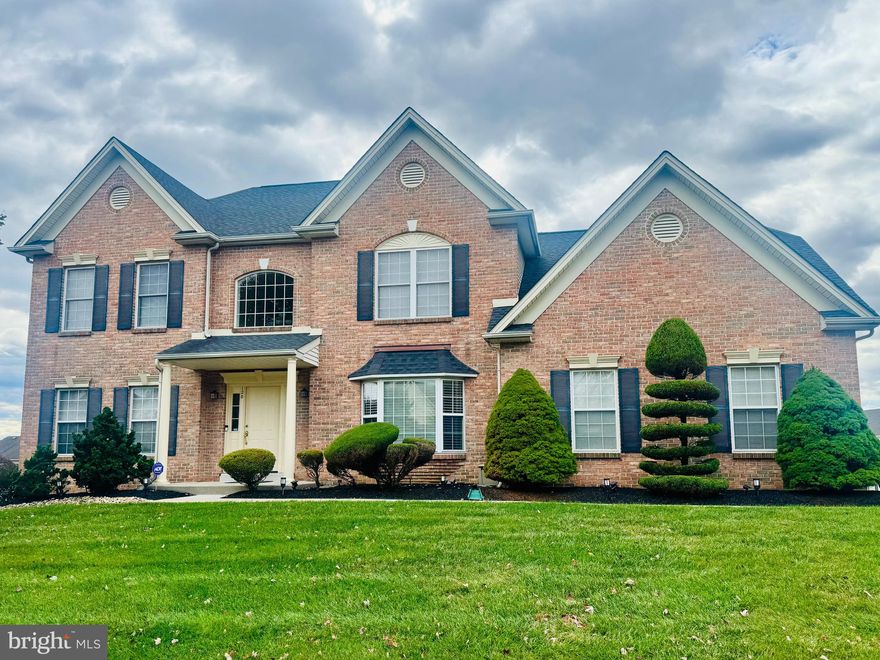 Welcome to 120 Statesman Road — where comfort, thoughtful updates, and timeless style come together in the highly sought-after community of Warrington Lea.

Step into the inviting two-story foyer and immediately feel at home. To your right, French doors open to a spacious private den—perfect for a home office or quiet retreat. To your left, the formal living room flows seamlessly into the dining room, creating an ideal setting for gatherings and entertaining.

The well-appointed kitchen and breakfast area feature 42-inch cabinetry offering abundant storage, granite countertops, a center island for meal prep, and a double stainless-steel sink. Sliding glass doors lead to a brand-new deck overlooking a large, open backyard — perfect for outdoor dining, play, or relaxation.

The bright and welcoming family room showcases a wall of windows that flood the space with natural light, complemented by beautiful hardwood floors, a vaulted ceiling, and a marble fireplace as the focal point. Hardwood floors continue through the living and dining areas, adding warmth and continuity throughout the main level. A separate office and a convenient first-floor laundry room complete this floor.

Downstairs, the finished walk-out basement provides versatile space for recreation, fitness, or storage. Major mechanical upgrades — including a new roof, new HVAC system, and new water heater — offer peace of mind, efficiency, and low-maintenance living for years to come.

Upstairs, the primary suite features generous dimensions, two large walk-in closets, and a spacious ensuite bath with a soaking tub and separate shower. Three additional well-sized bedrooms and a full hall bath complete the second floor.

Located within the award-winning Central Bucks School District, this beautifully maintained home offers easy access to the Pennsylvania Turnpike, major highways, train stations, and shopping — combining convenience, comfort, and community in one exceptional address.