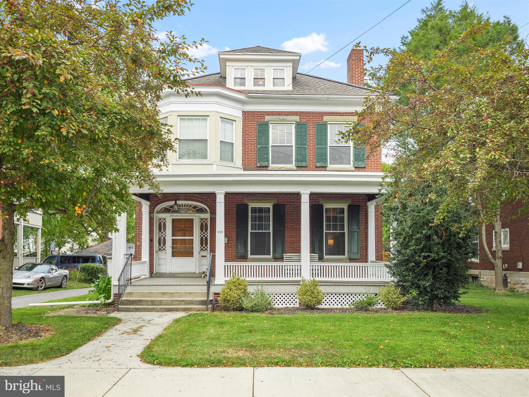 Astounding character with modern comfort! This timeless red brick home offers a fantastic location with great walkability and is extremely spacious to make into the home of your dreams. Historic character without regulations of a historic oversight committee. The front of the home provides a gorgeous, large covered porch with tongue and groove boards, freshly done sidewalks, and a charming front door with unique glass and a mail slot right in the sidelight of the door. The rear of home offers a 2 car detached garage, privacy fenced backyard & stone patio space. Inside, a welcoming entry opens to a large living room with fireplace, mantle, and built in bookcases. The dining room has space for a 10 person table with ease. In the kitchen, a cheerful blue has been painted on the cabinets, marble style epoxy on the countertops, recessed LED lighting installed, a breakfast bar plus a "drop zone" bench space for shoes. A half bath on the main floor offers added convenience. The sun-drenched back morning room has another fireplace and provides a way out to the back yard. The yard provides green space for soaking up some vitamin D and there's a 2 car detached garage with newer metal roof installed in 2023. In front of the garage you have space for parking multiple vehicles as well. Going up to the second floor: glass door knobs are a whimsical touch along with shutter style window treatments on the front bedroom over a window seat bench. A very large back bedroom looks over the backyard and adjoins to the 4th bedroom which could make a great home office, nursery setup, etc. The full bathroom has a tub/shower combo, plus 2 pedestal sinks. You'll also notice the temperature is well kept between floors 1 and 2 thanks to 2 zones of heat/air with the upstairs unit being new in 2023 and the downstairs new in 2025. Up on the 3rd floor, there's a partially unfinished side that can be used for storage. The finished side can be a bedroom, office, den, or so much more. A 3/4 bathroom (tub, sink and toilet) is also on the 3rd floor. Property is located in a walkable neighborhood of Waynesboro, close to the public schools. Memorial park, the local gym, restaurants and more are also only a block away. Check into Mainstreet Waynesboro and Borough of Waynesboro's websites to see many of the great offerings the town has, including seasonal farmer's markets, a community pool with discounted rates for borough residents, many parks, events, parades, etc.