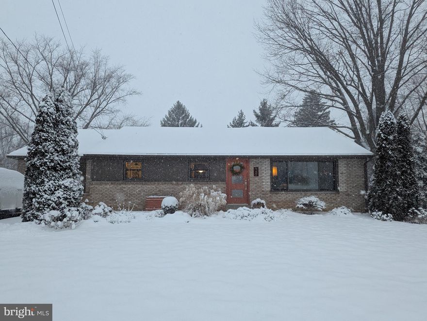 You won’t want to miss this beautifully renovated ranch home, thoughtfully updated from top to bottom. The gourmet kitchen shines with white soft-close cabinetry, under-cabinet lighting, leathered granite countertops, a stylish tile backsplash, an electric induction range, vented hood, and a spacious pantry area. The updated bathroom features a tile floor, new vanity, tiled surround, and modern plumbing fixtures. Energy-efficient improvements include a new heat pump installed in 2024 and all-new windows added between 2015 and 2018. Original hardwood floors run throughout most of the home, complemented by an upgraded 200-amp electrical service. Outside, the flat backyard provides an ideal space for outdoor entertaining and relaxation.