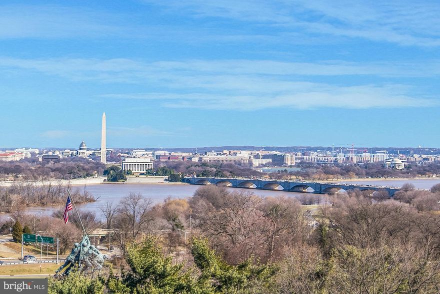 OPEN SUNDAY (02/28) 1-3PM! Best views of DC! Stunning 5-level townhome at Monument Place with 3 Bedrooms, 3 Full Baths + 2 Half Baths, Owner Suite with Steam Shower and separate jetted tub. Two Fireplaces, gourmet granite kitchen with island, open living space, high ceilings, private roof deck, Elevator, and 2-car gar.  Across the street from Iwo Jima and just a half-mile to Rosslyn Metro Station.