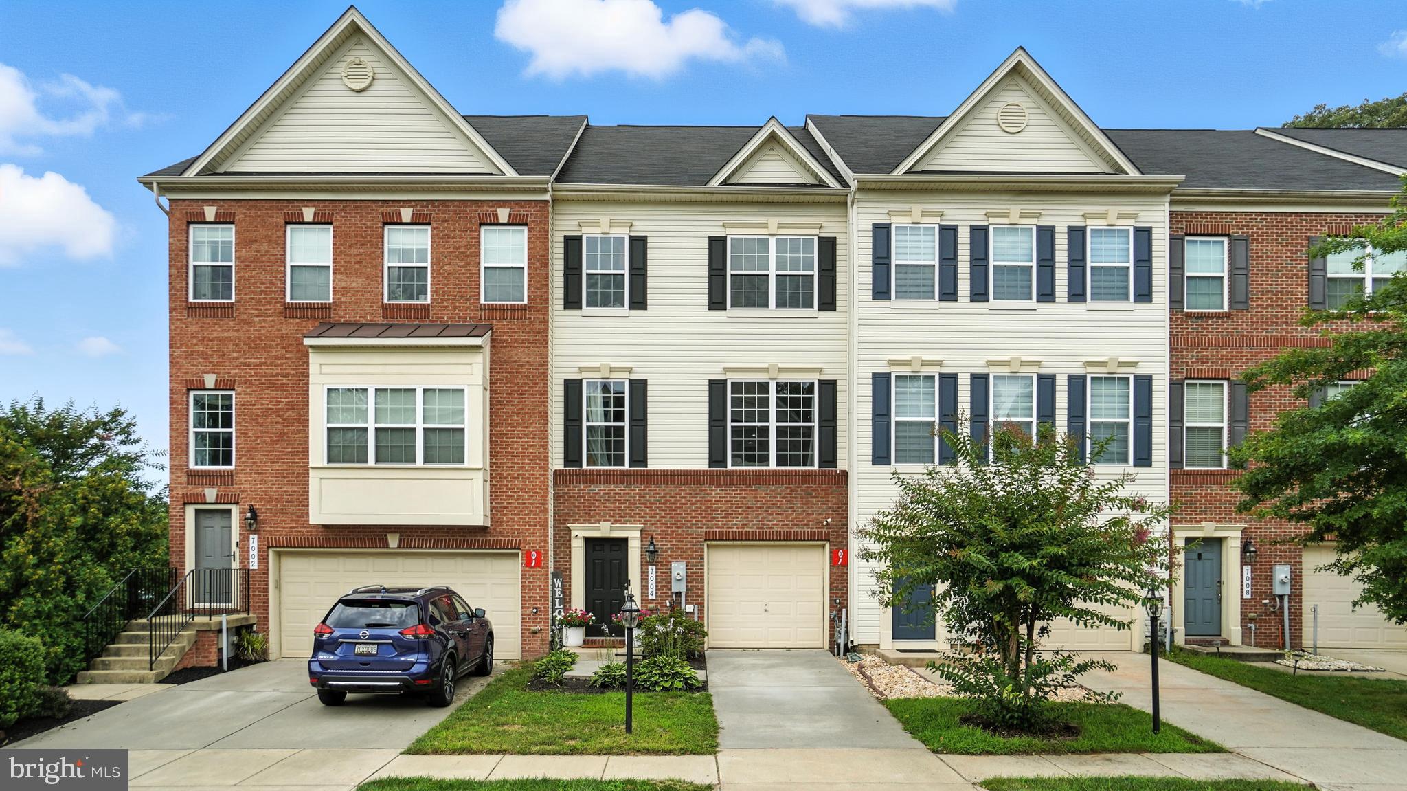 Welcome to Dannfield Court, a beautifully maintained and thoughtfully upgraded 4-level townhome tucked away in a quiet, front secluded section of the highly desirable Tanyard Springs community. As a former model home, this property is packed with premium features and offers a flexible layout with 5 bathrooms (2 full, 3 half). The main level boasts an open-concept design with gleaming hardwood floors, recessed lighting, and a spacious carpeted living area that flows seamlessly into the kitchen and dining space. The kitchen features granite countertops, a large center island, stainless steel appliances with direct access to a maintenance free deck that’s perfect for outdoor entertaining. Upstairs, you'll find three generously sized bedrooms, including a primary suite with a walk-in closet and en-suite bath. The washer and dryer are conveniently located on the bedroom level. The top level is a true showstopper: a large 4th-floor loft with half bath that opens to a private rooftop deck—an ideal spot for relaxing, entertaining, or enjoying peaceful sunset views. The entry-level offers a flexible rec room complete with built-in surround sound, its own half bath, walk out, and garage access. Fresh paint in select areas, energy effiecient dual zone HVAC and a whole-home security system add comfort and peace of mind. Enjoy all the resort-style amenities Tanyard Springs has to offer: outdoor pools, a clubhouse with fitness center, dog parks, playgrounds, tennis and basketball courts, and miles of walking/jogging paths. This home truly offers the best of everything: location, space, updates, privacy, and a vibrant community. Don’t miss your chance at this one and see why 7004 Dannfield Court is the one! Professional pictures and Matterport will be available the first week of August.