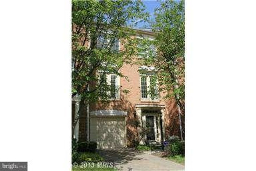 Federal-style garage town home in N. Reston with easy access to Dulles Toll Rd and Wiehle metro stop. Prime lot off the beaten path. Gourmet kitchen (granite & stainless) opens to breakfast area & family room. Light-filled living/dining room with hardwood floors on main level. Two half baths: lower and main levels. Rear patio & deck back to trees. Ready to move in.