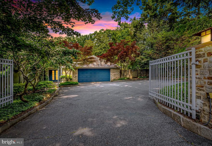 Trust your instincts. Stunning contemporary stone retreat on over an acre with lush landscaping offers privacy and sanctuary for those seeking refinement and accessibility in one of Baltimore County’s most beautiful and convenient neighborhoods. Built in the mid-20th century, design elements include exterior stone walls, maple flooring with cherry and mahogany inlay, clean lines, open flow, and gallery walls for collections. Skylights and large windows offer plenty of natural light and garden views from almost every room. The main level offers one-floor living opening to three unique outdoor living areas. It features a formal living room with a gas fireplace, a dining room with a wood-burning fireplace, an owner's suite and study, and a two-bedroom wing with a full bath and laundry. Additionally, there is a sunroom with built-in cabinetry and a wet bar, plus a sitting room next to the kitchen and dining room. The gourmet kitchen includes a large island, quartzite counters, a Subzero 48” Pro fridge/freezer, a Wolfe dual-fuel gas range, wall and steam ovens, a Décor warming drawer, a Subzero wine fridge, and two sinks and dishwashers. A glass bay surrounds the breakfast area, and nearby French doors open to the side terrace for kitchen gardening and barbecues, and easy access to the level lawn. The upper-level features two generously sized bedrooms, a full bathroom, and a storage room. The bluestone rear terrace, with sitting walls, stretches under a towering American beech tree, offering ample space for large gatherings. Walk through the boxwood allée and perennial garden paths to reach the heated pool with retractable cover and access a pool house equipped with a kitchenette and full bath for pool parties, workouts, or use as a remote workspace. Walk through Woodbrook to Lake Roland, a 500-acre nature preserve with trails, a dog park, and a nature center, or visit the charming village across Charles Street for a boutique grocery and morning coffee. With its many amenities and thoughtful design, this property offers a lifestyle where location, comfort and quality enhance daily living. Only minutes to schools, I-695, and metro Baltimore on the harbor.